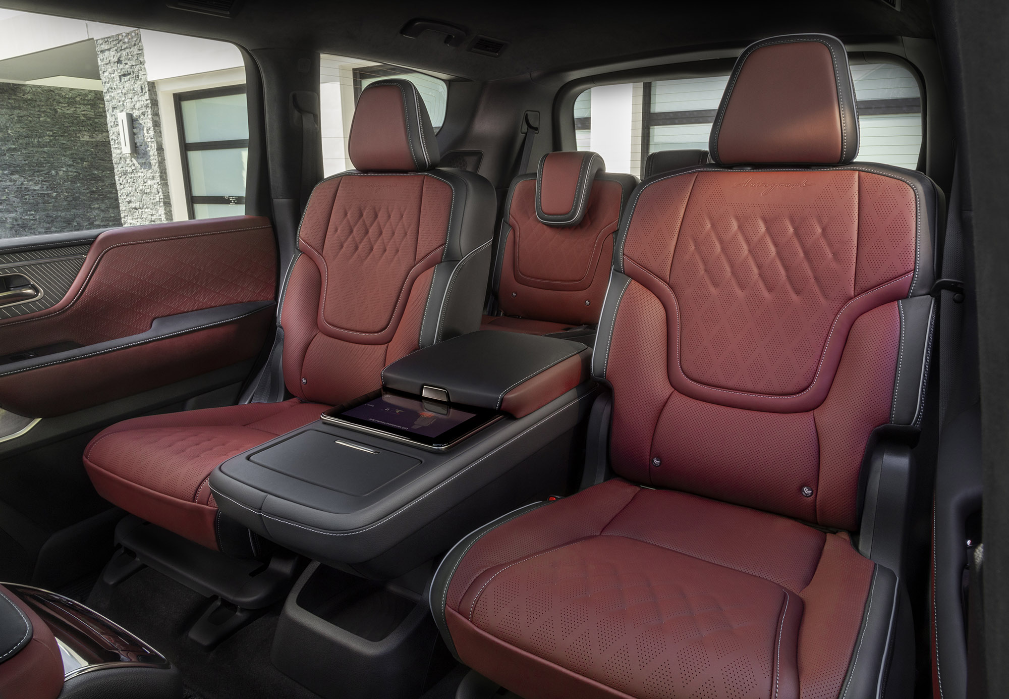 2025 Infiniti QX80 second-row quilted-leather captain's chairs in red