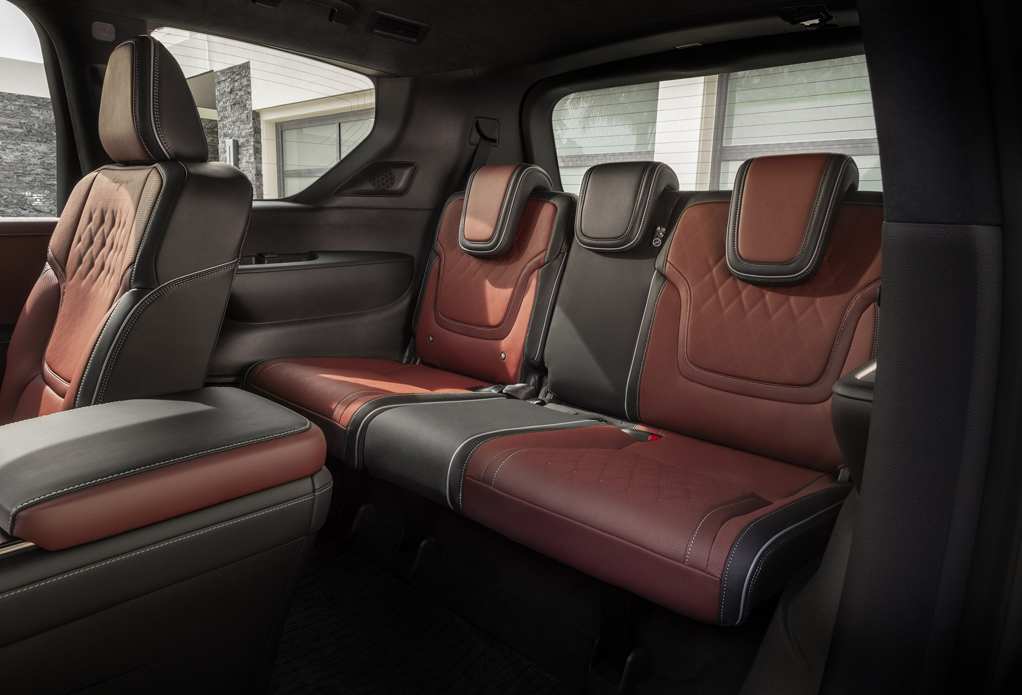 2025 Infiniti QX80 third-row seats in red