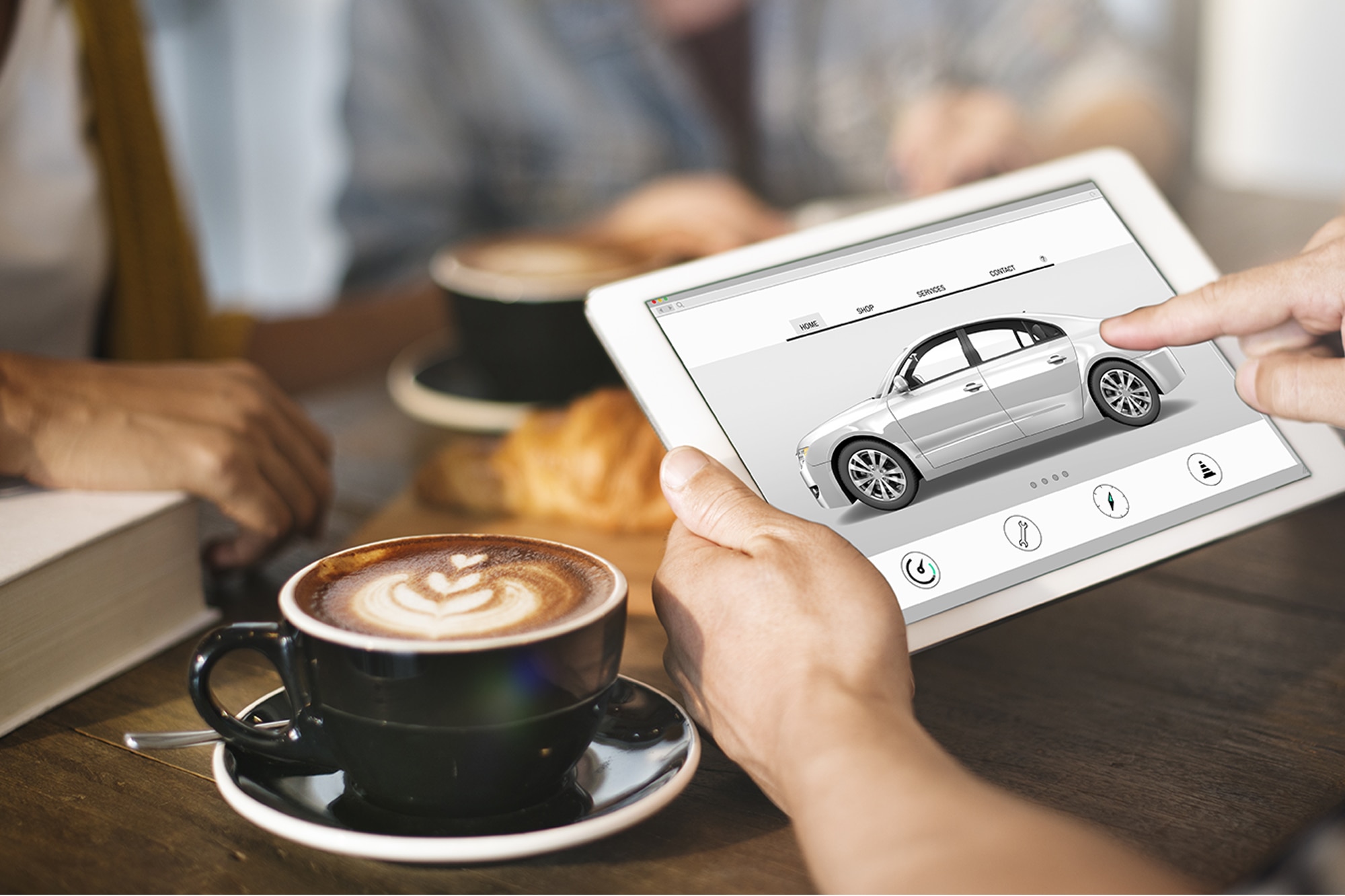 Car sales automobile vehicles concept on a tablet in a coffeeshop