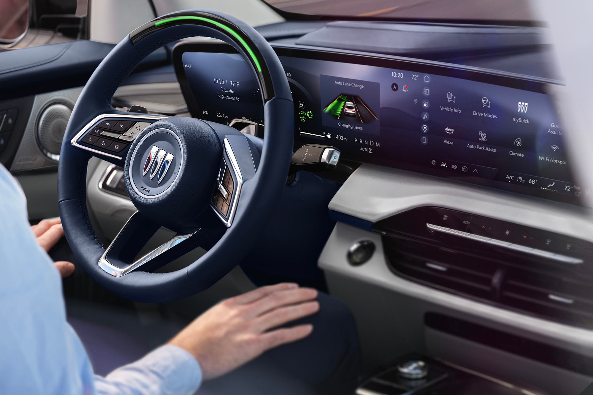 Person sits behind wheel of 2025 Buick Enclave with hands in their lap and Super Cruise active