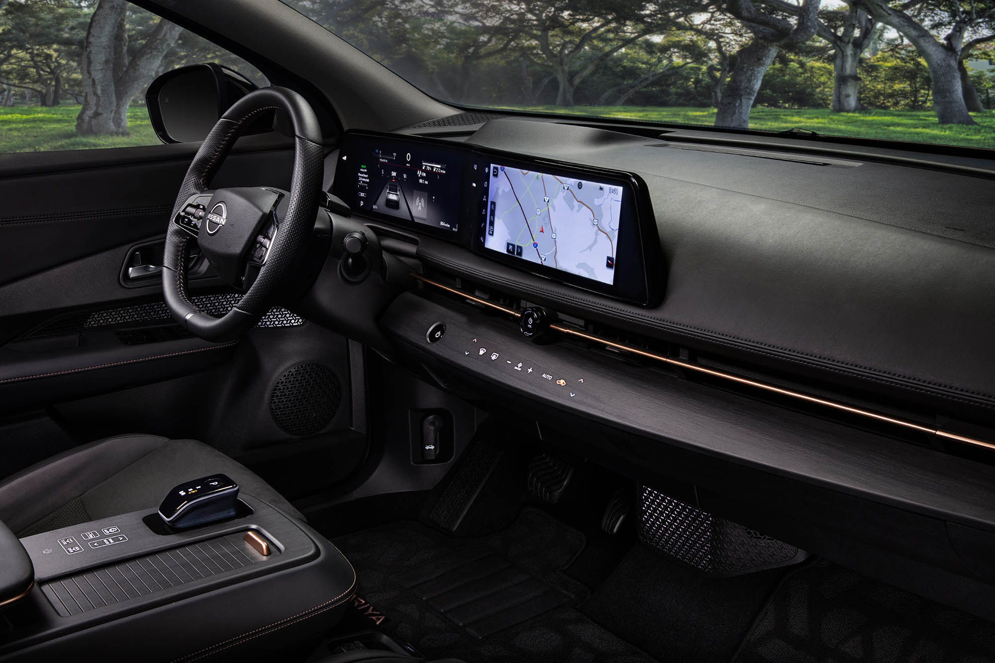 Nissan Ariya electric vehicle interior and steering wheel.