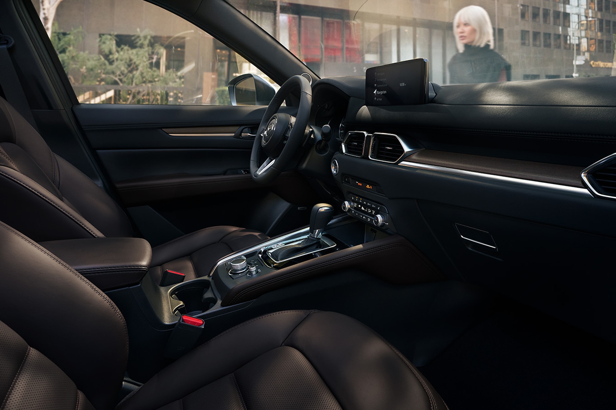 Mazda CX-5 interior with woman outside