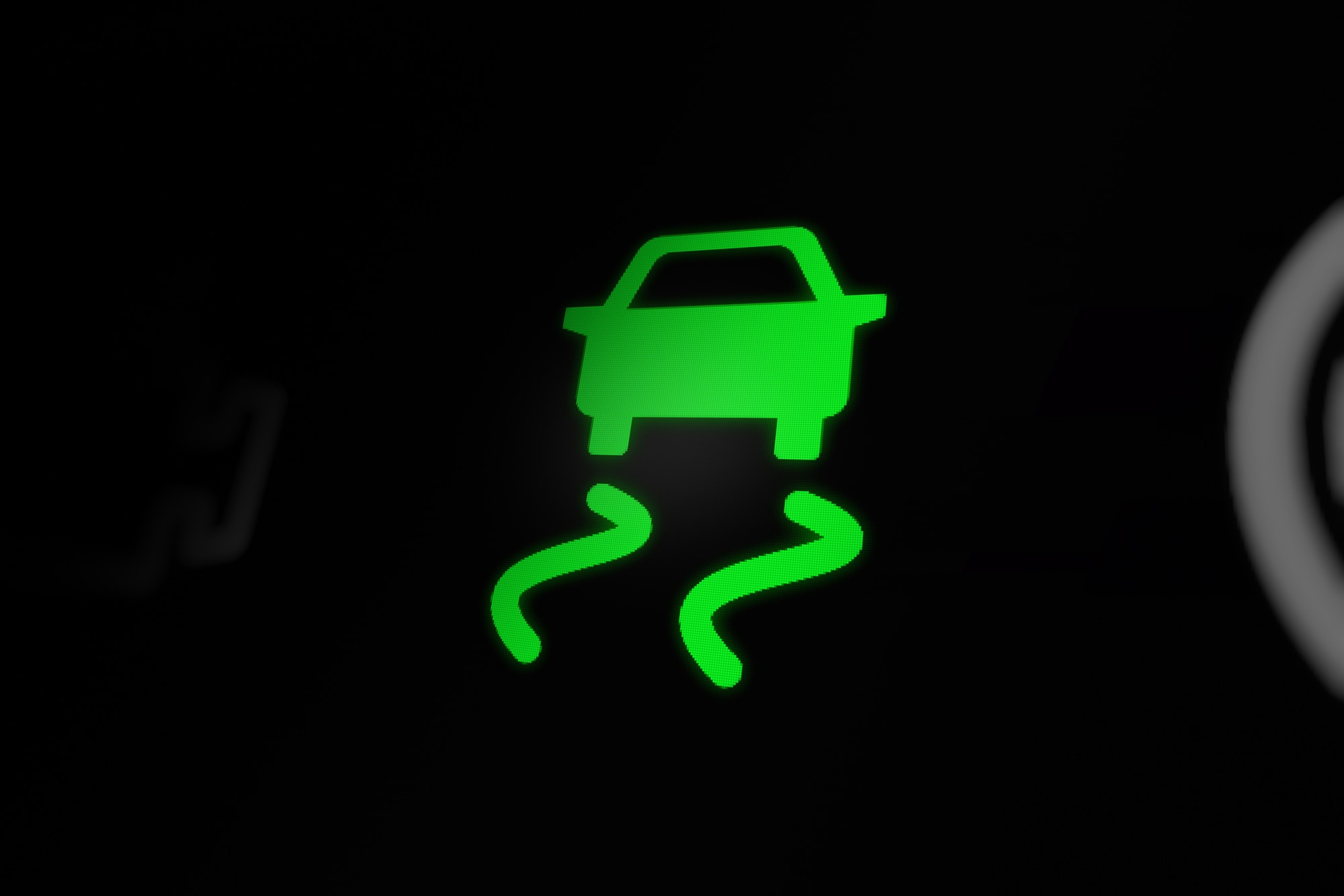 Green car graphic skidding on black background (ESC graphic)