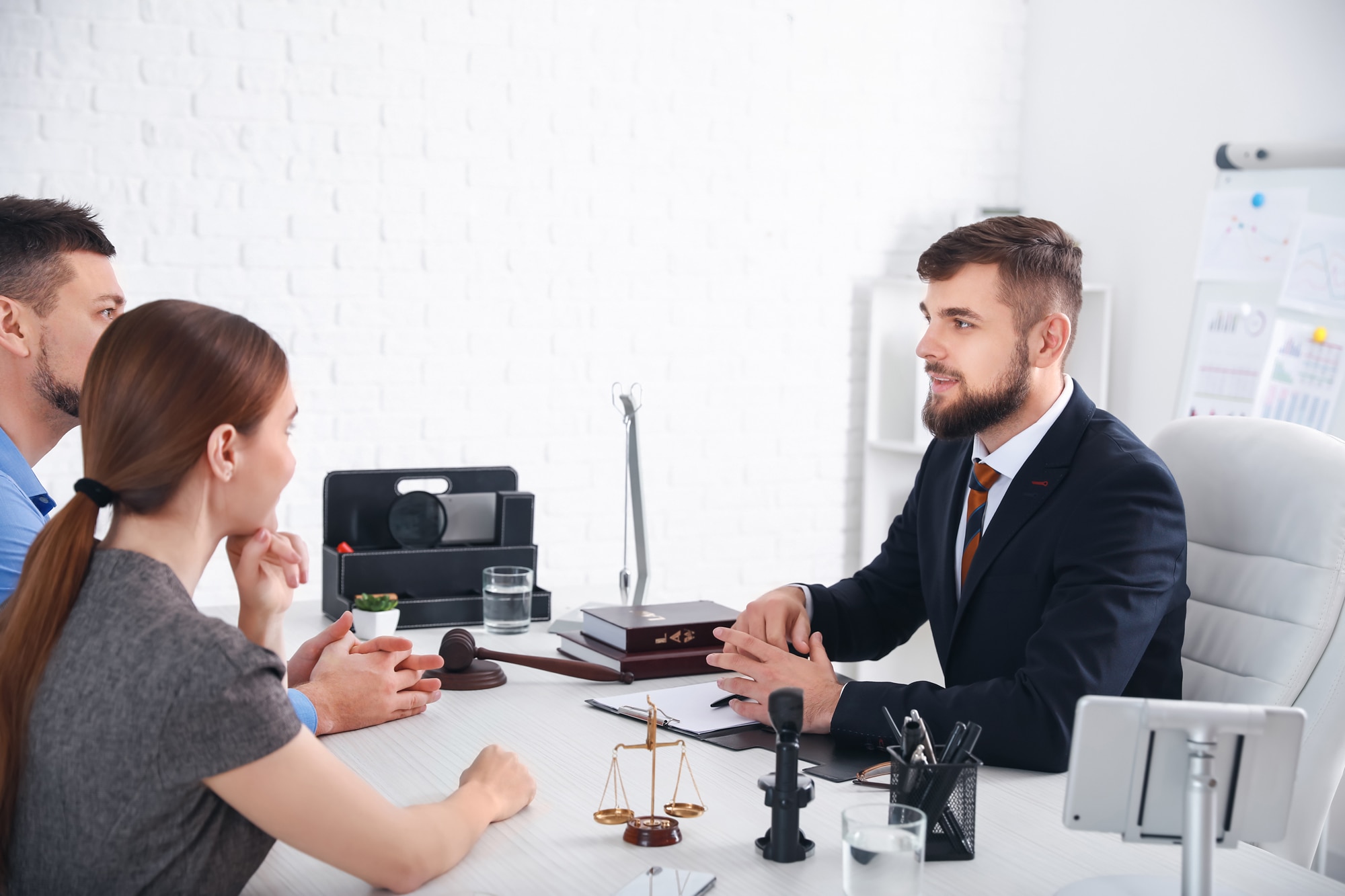 Lawyer discussing with couple in office