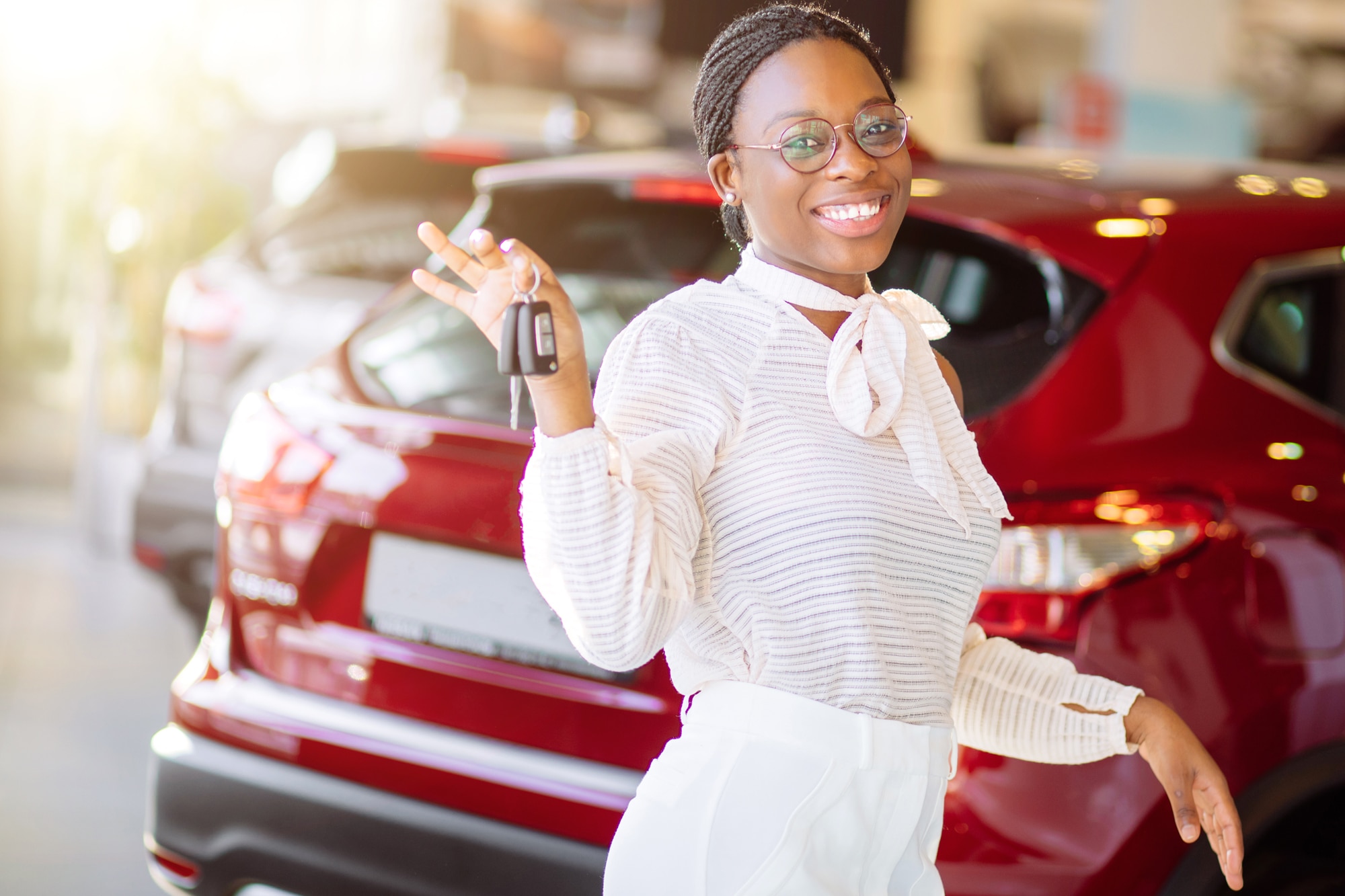 African American woman showing off her new car keys