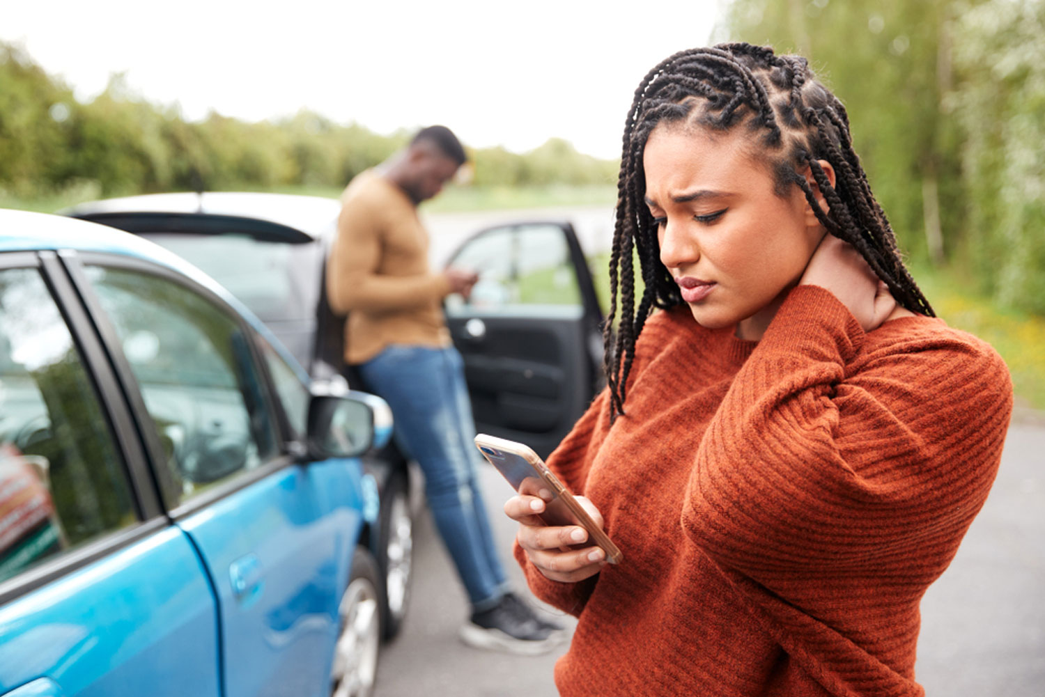 Woman concerned about car checking phone