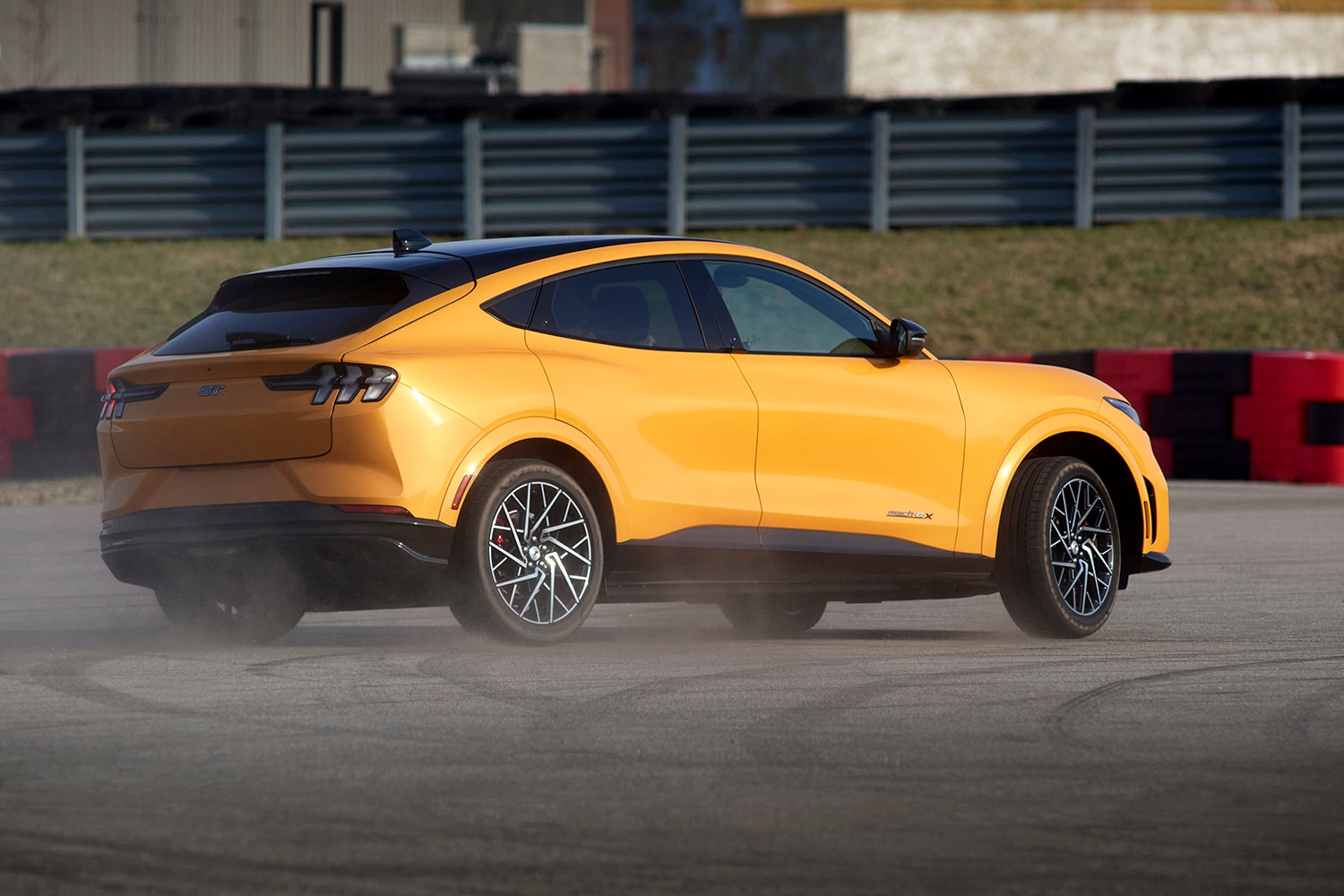 Ford Mustang Mach-E GT, yellow, drifting, rear