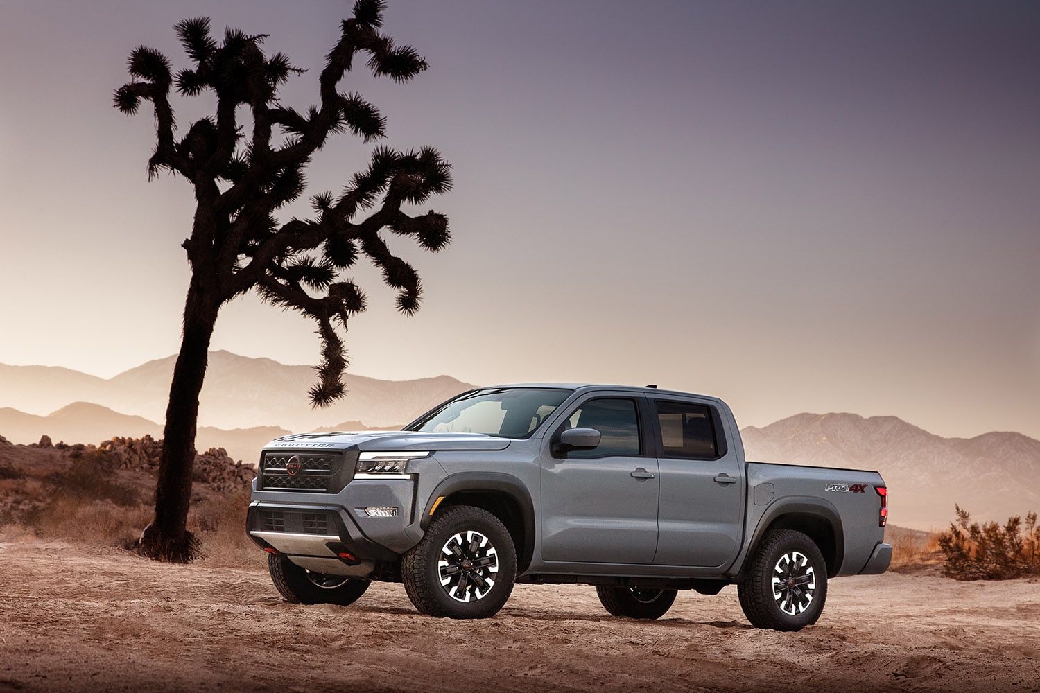2023 Nissan Frontier parked by a Joshua Tree