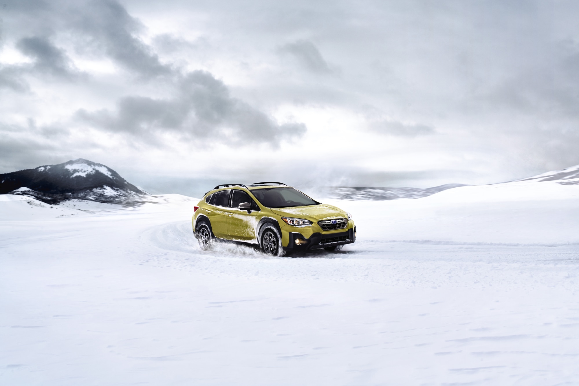 Neon 2023 Subaru Crosstrek driving in snow
