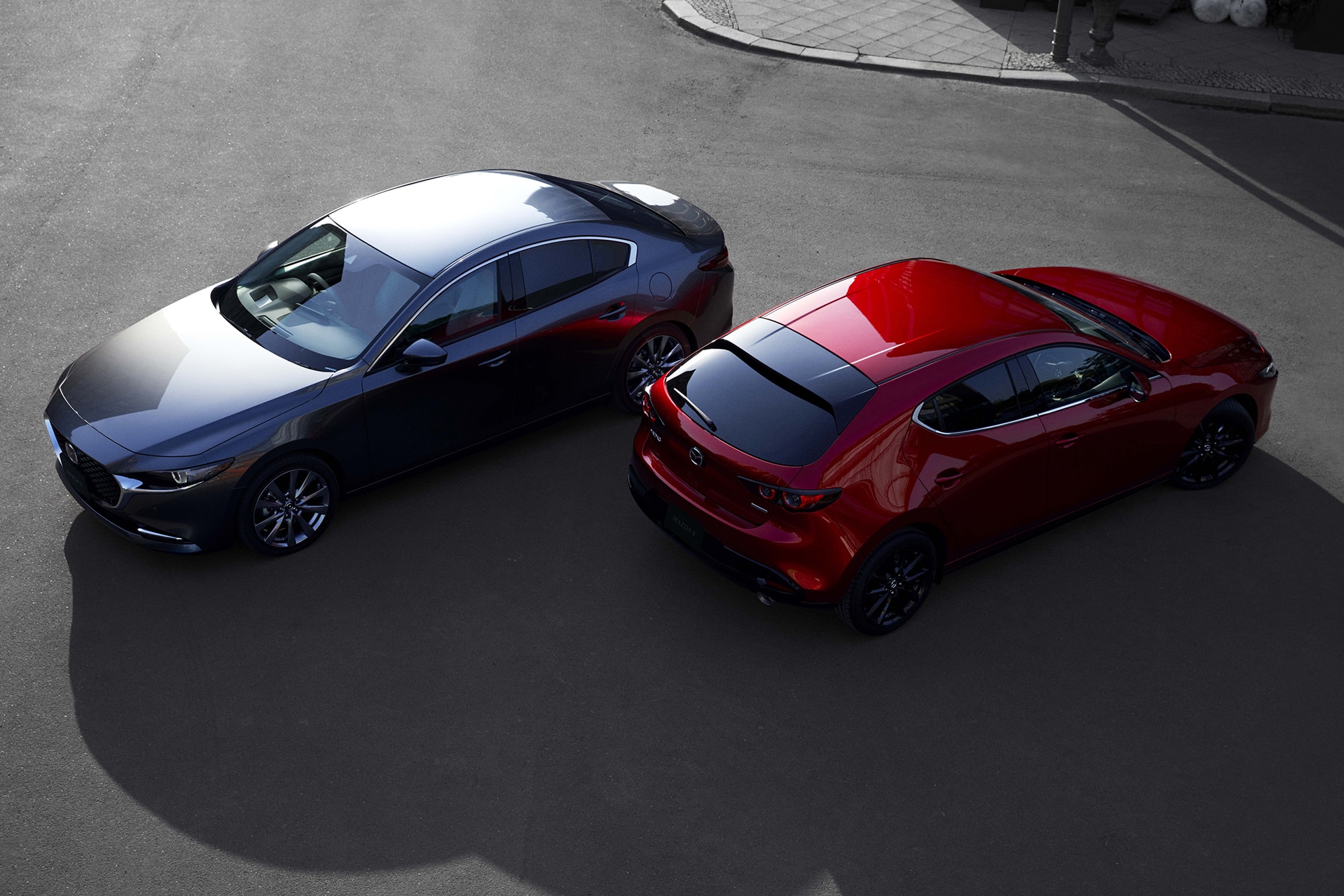 Red undefined Gray Mazda cars parked