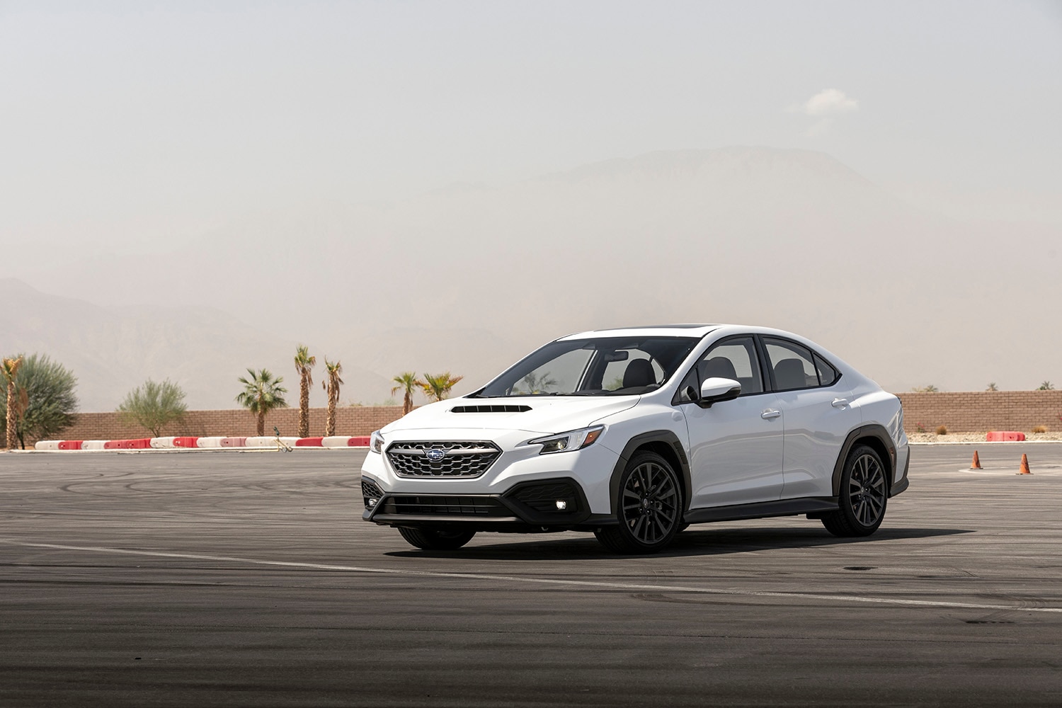 2023 Subaru WRX in white parked at a desert race track