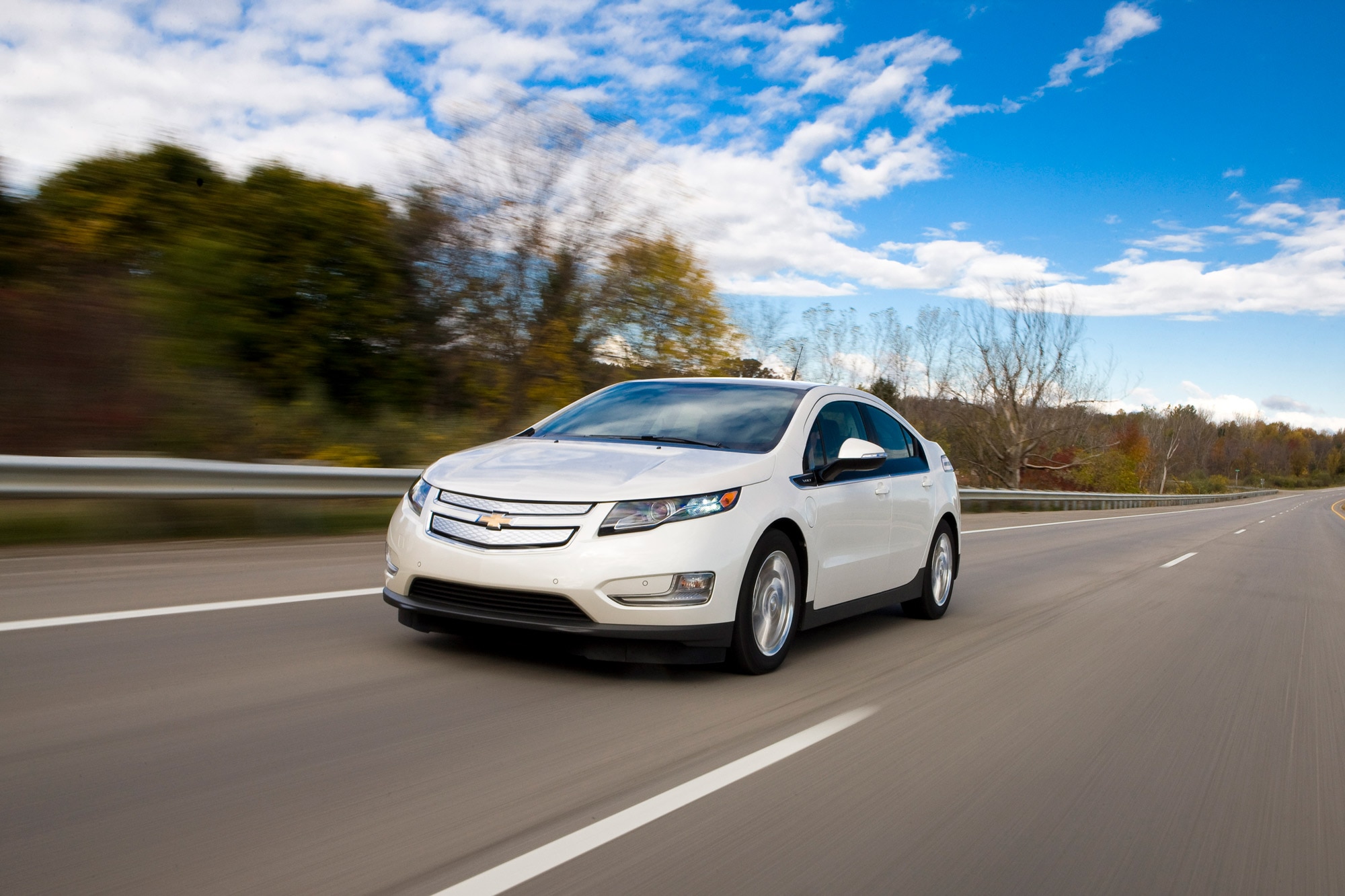 White 2015 Chevrolet Volt driving down highway