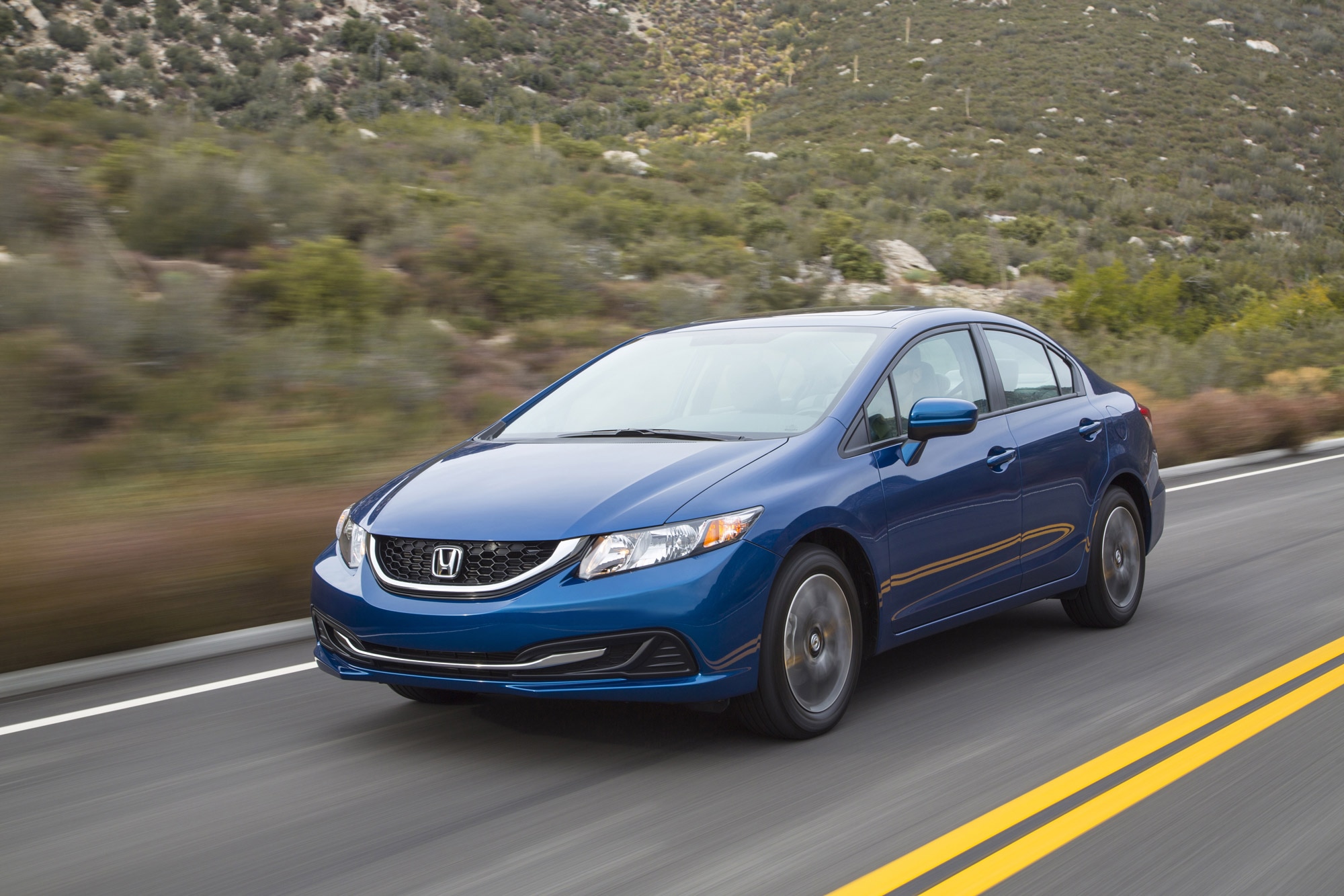 Blue 2014 Honda Civic Sedan on the highway