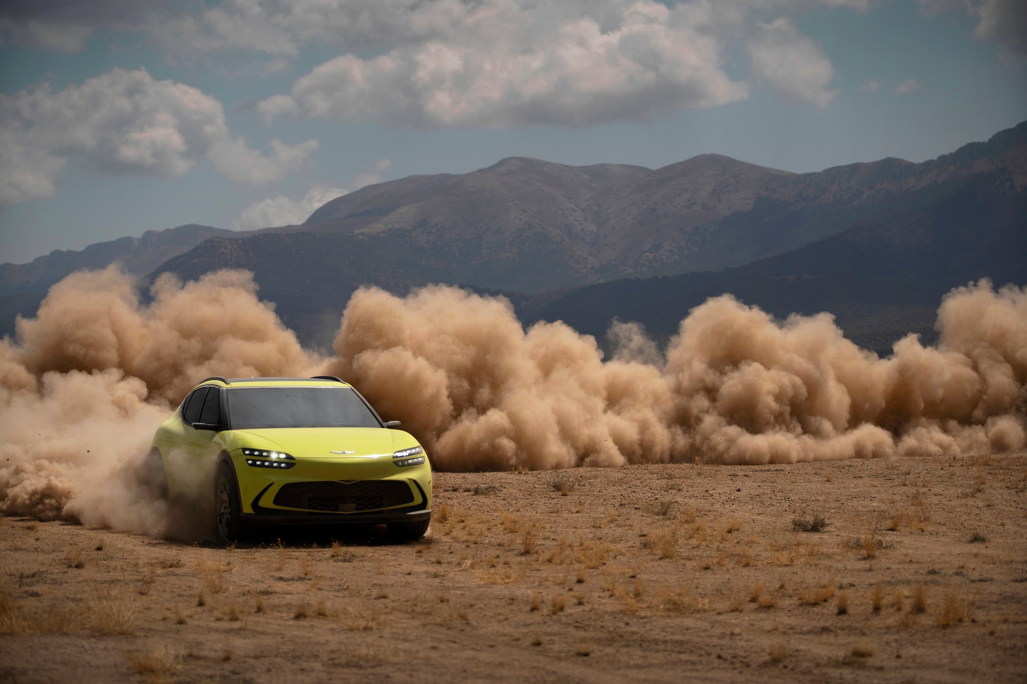 Sao Paulo Lime Genesis GV60 EV driving and creating the sandstorm by the mountains