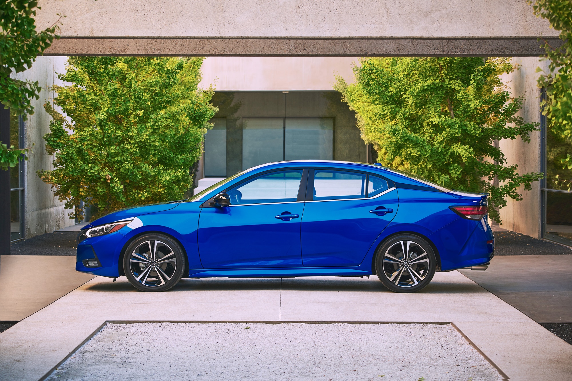 Blue 2019 Nissan Sentra in front of building