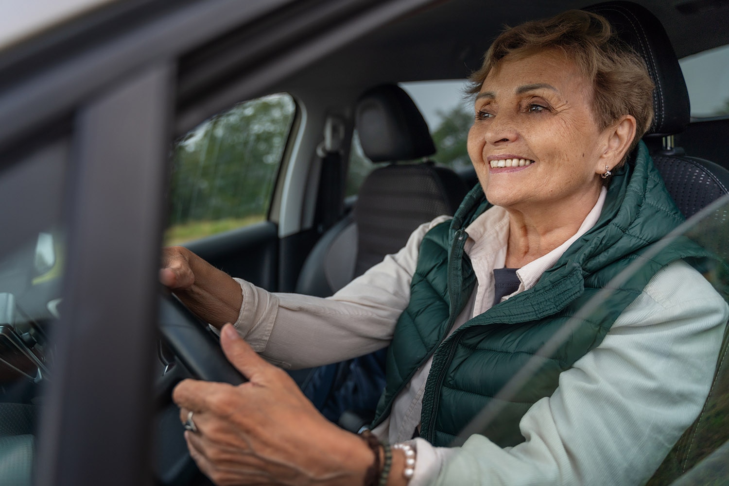 Older woman behind the wheel of a car