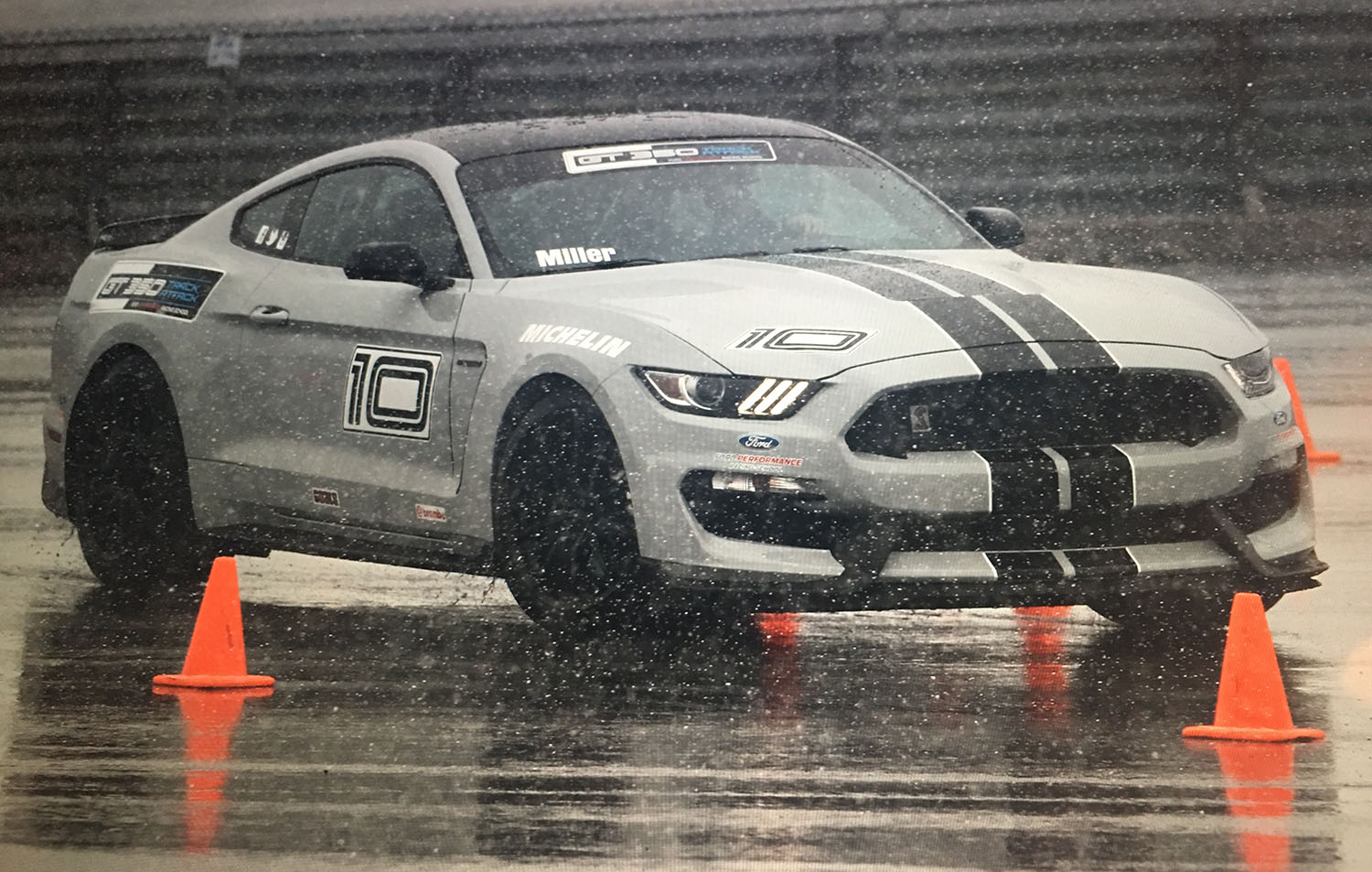 Car driving on track in snow and sleet