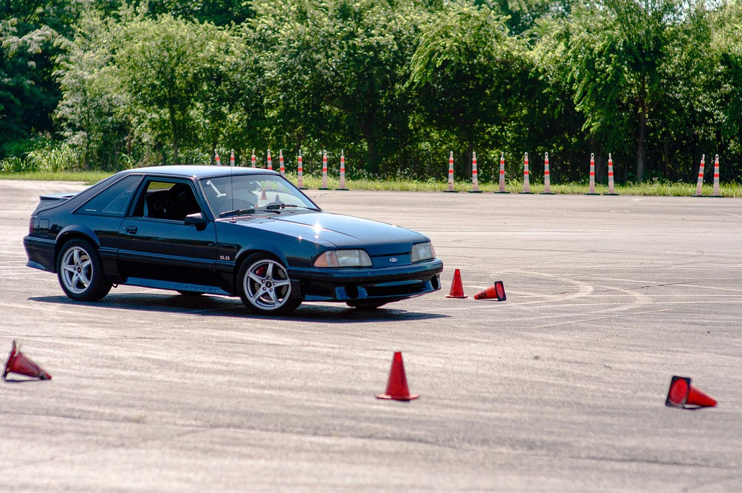 Car with cones trying precision driving