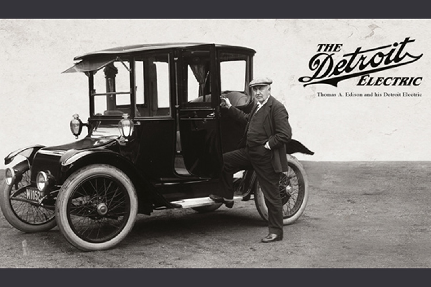 A black and white picture of Thomas Edison and his Detroit Electric car