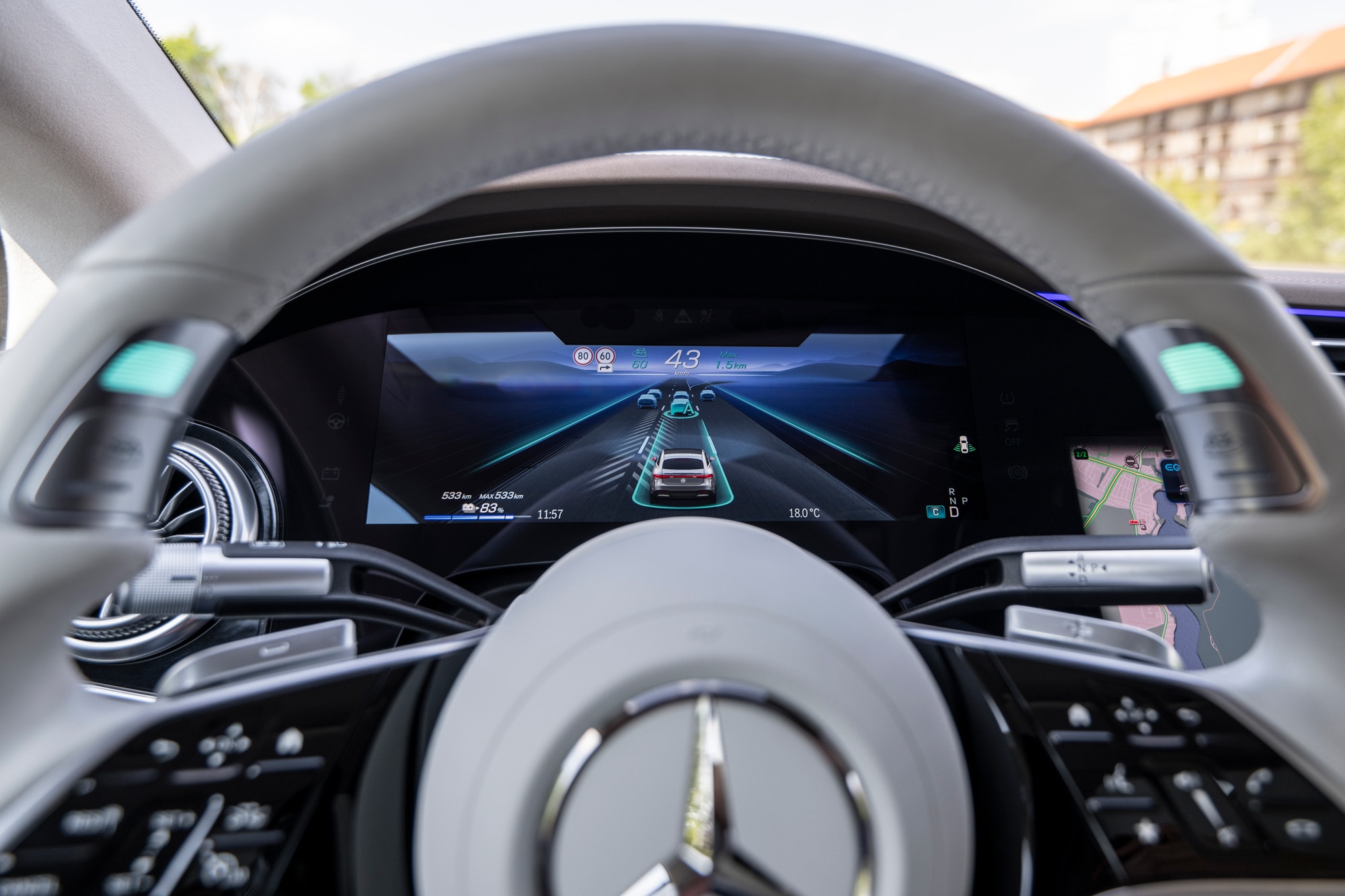 Mercedes-Benz steering wheel and dashboard displaying Drive Pilot at TecDay Berlin