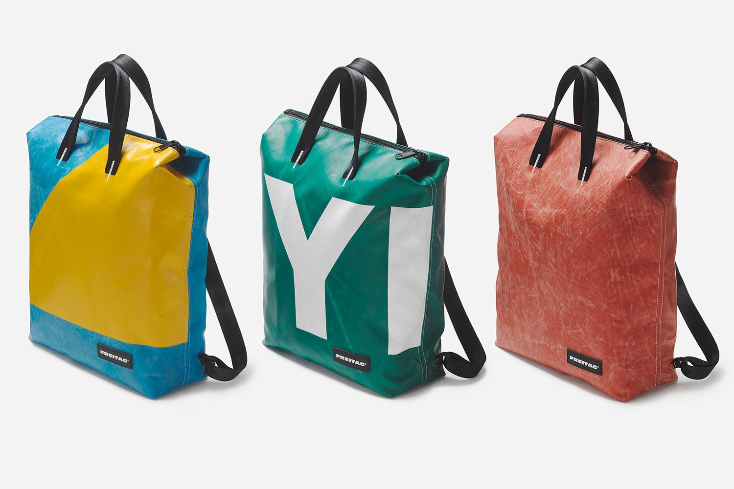 Blue, yellow, green, white, and red bags made from recycled car components
