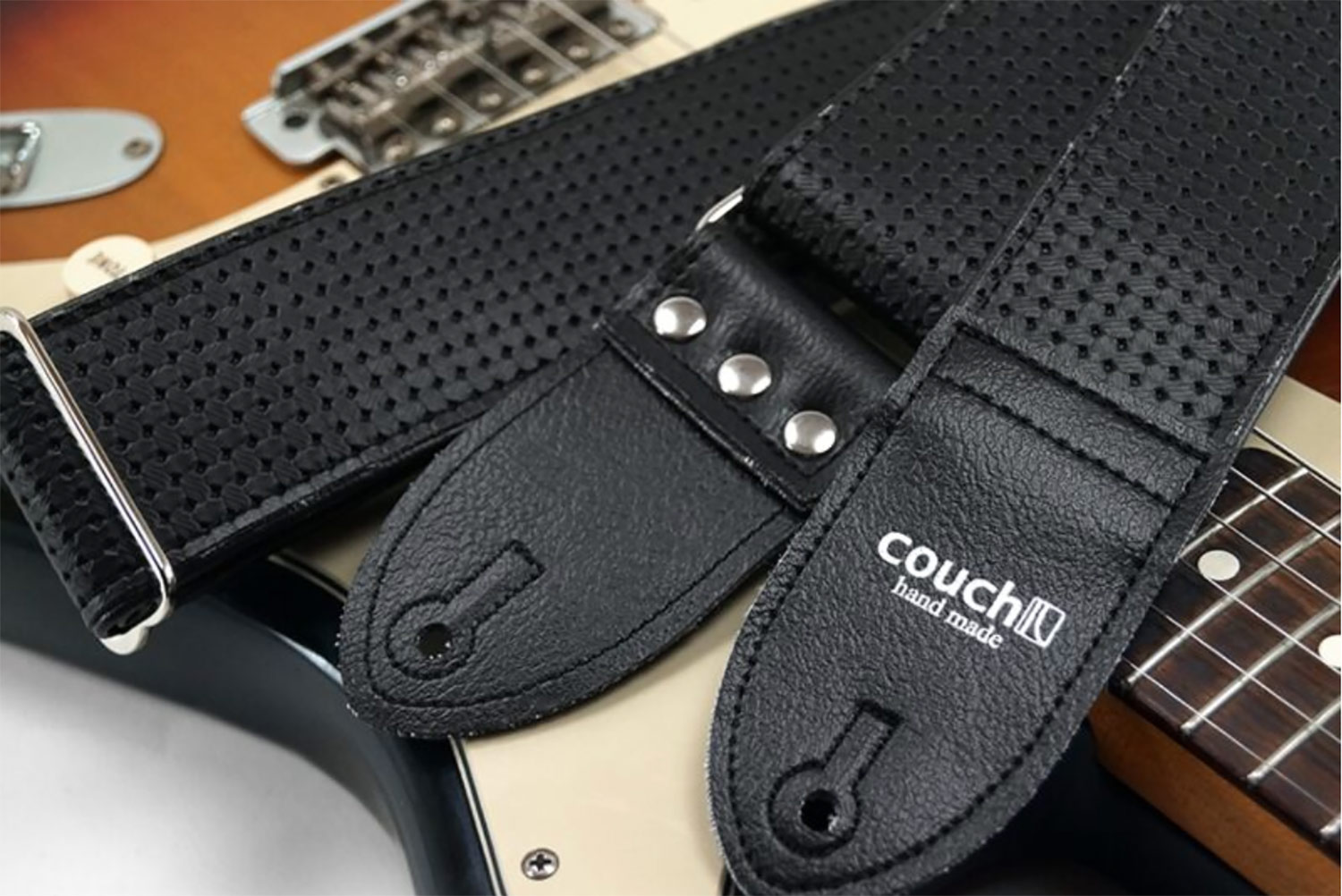 Black guitar strap made from car components