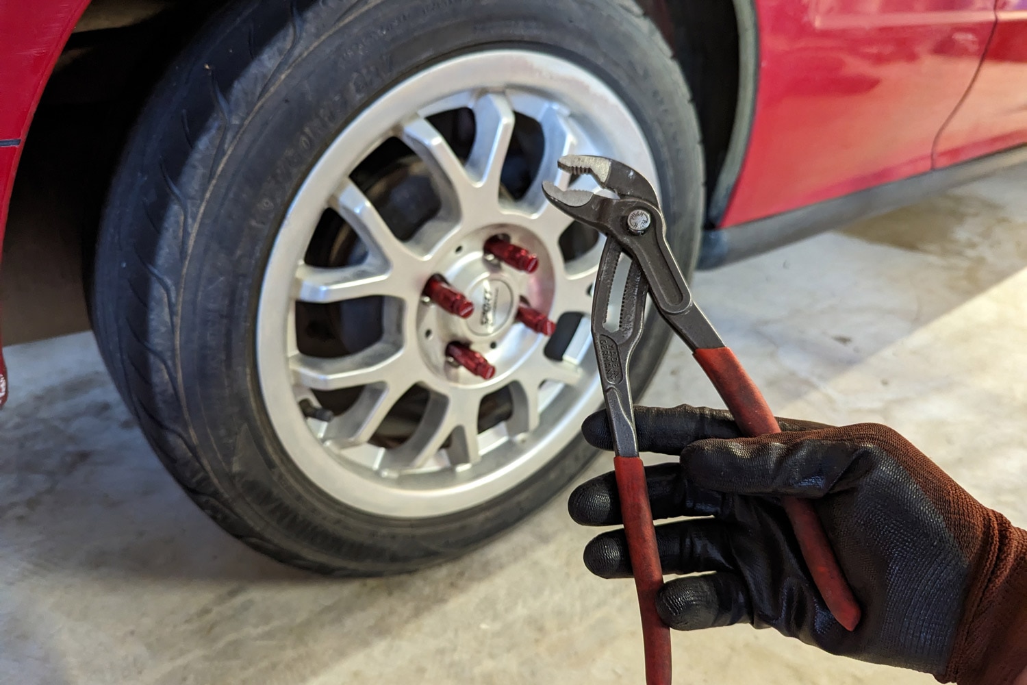 Wheel locks removed with tool in hand
