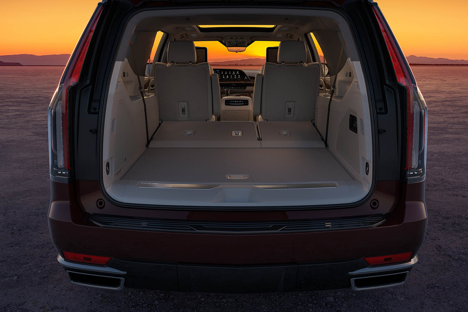 Back view of 2023 Cadillac Escalade ESV with rear door open to show interior cargo space