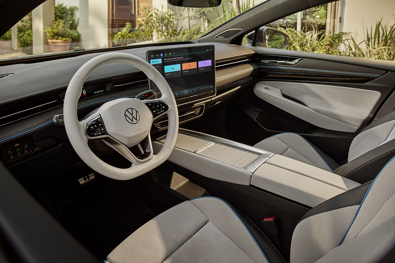 2024 Volkswagen ID.7 white interior, dashboard, and infotainment screen.