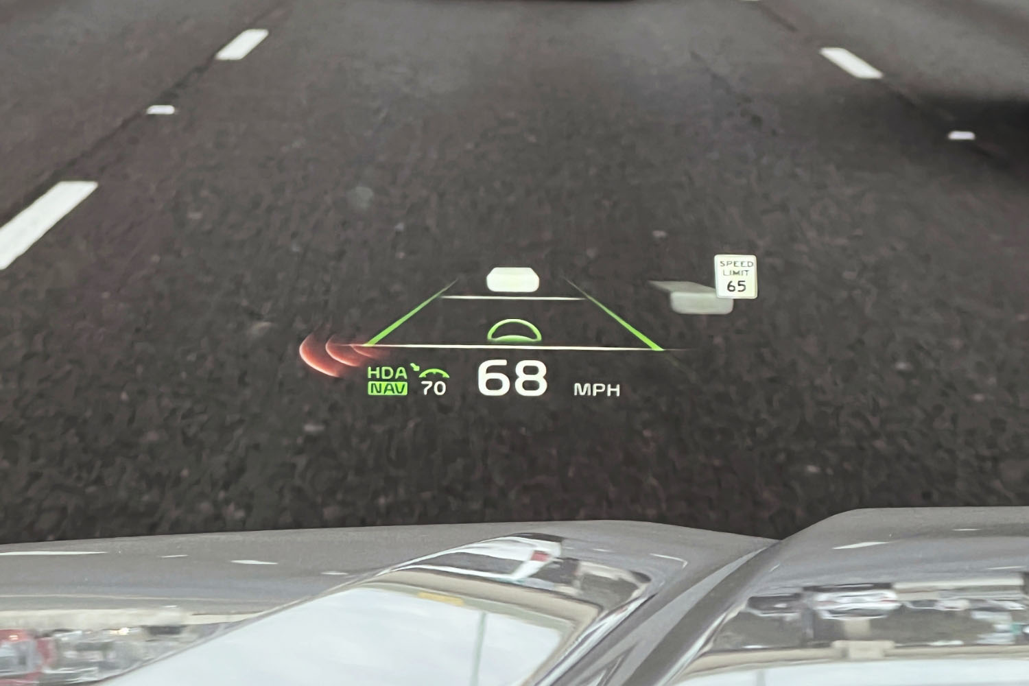 2023 Kia Telluride head-up display at speed on highway.