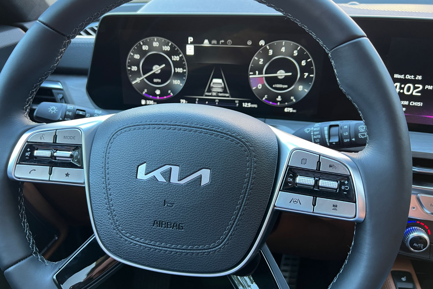 2023 Kia Telluride steering wheel and digital instrument display.