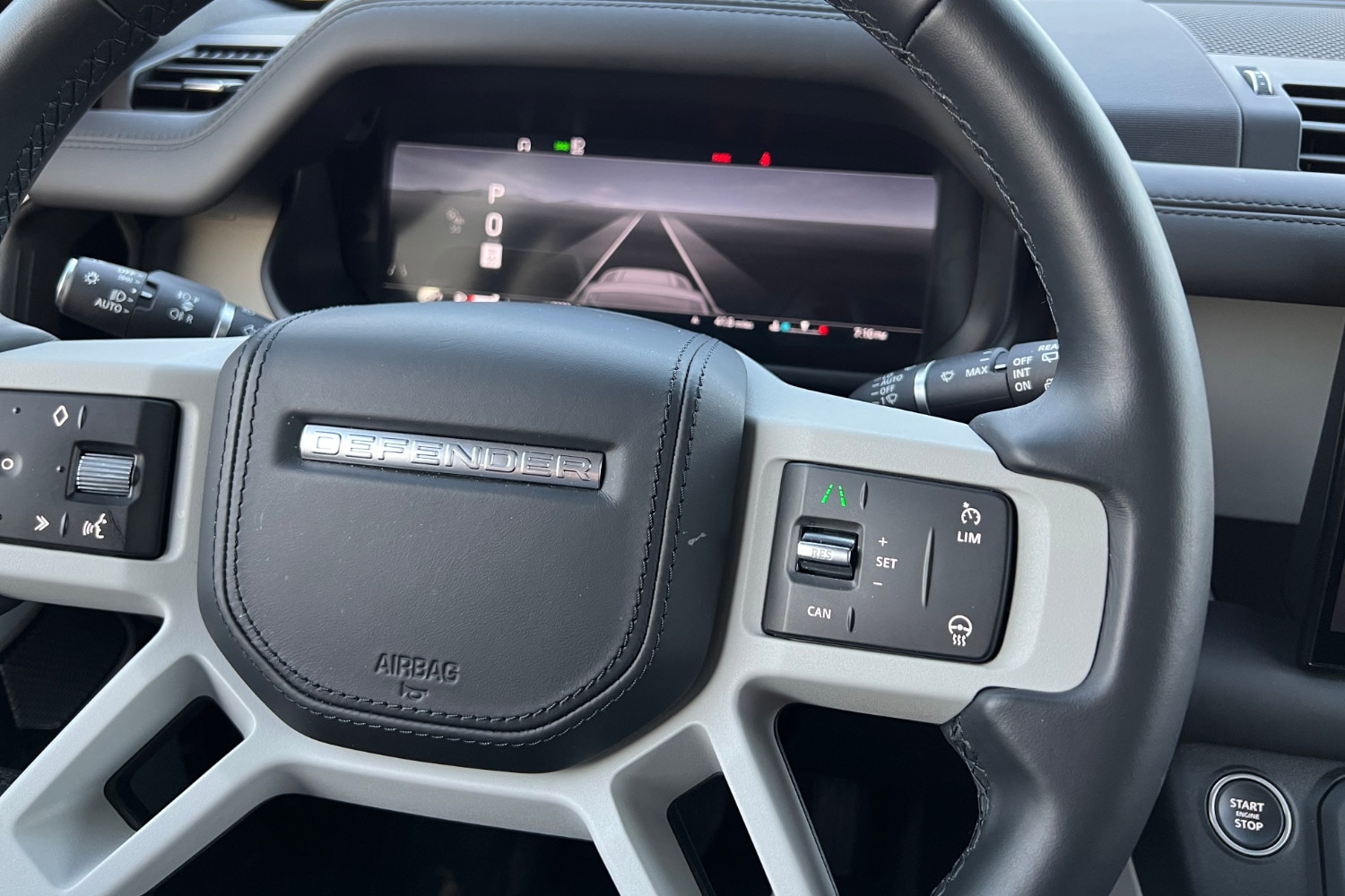 The steering wheel controls and driver's digital control screen