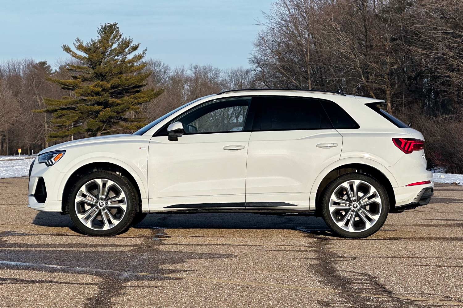 Side view of a white Audi Q3.