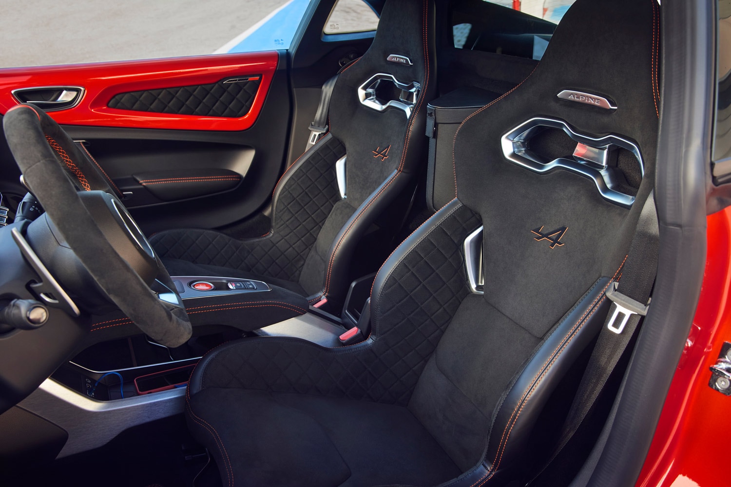 The interior of an Alpine sports car featuring racing seats
