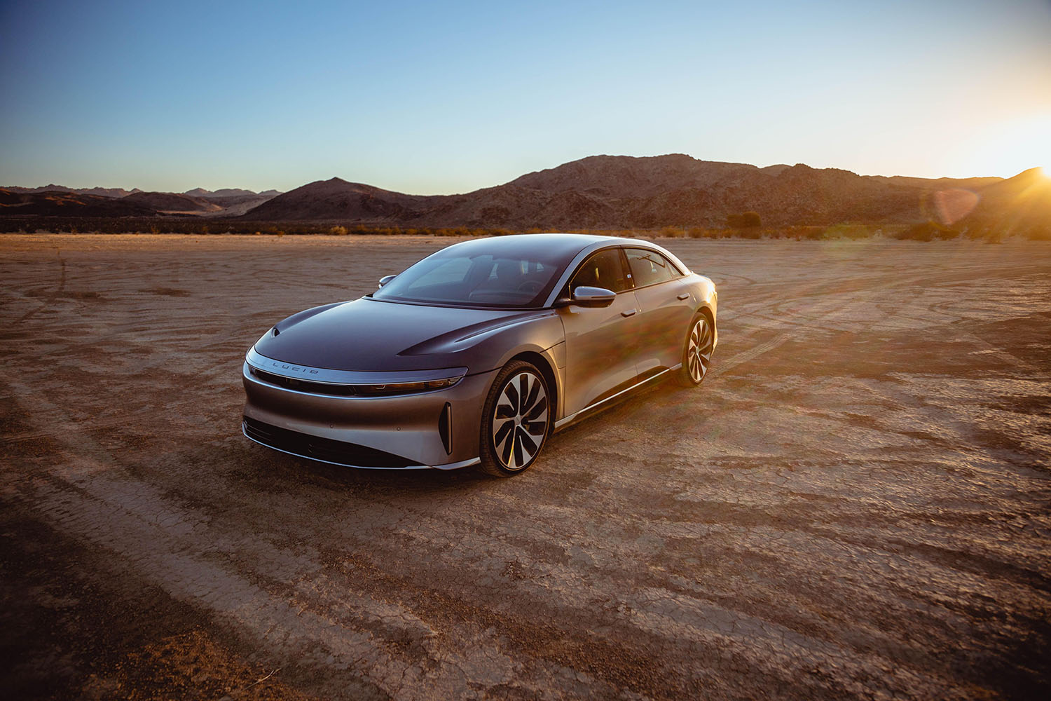 Lucid Air in gray with mountains in the background