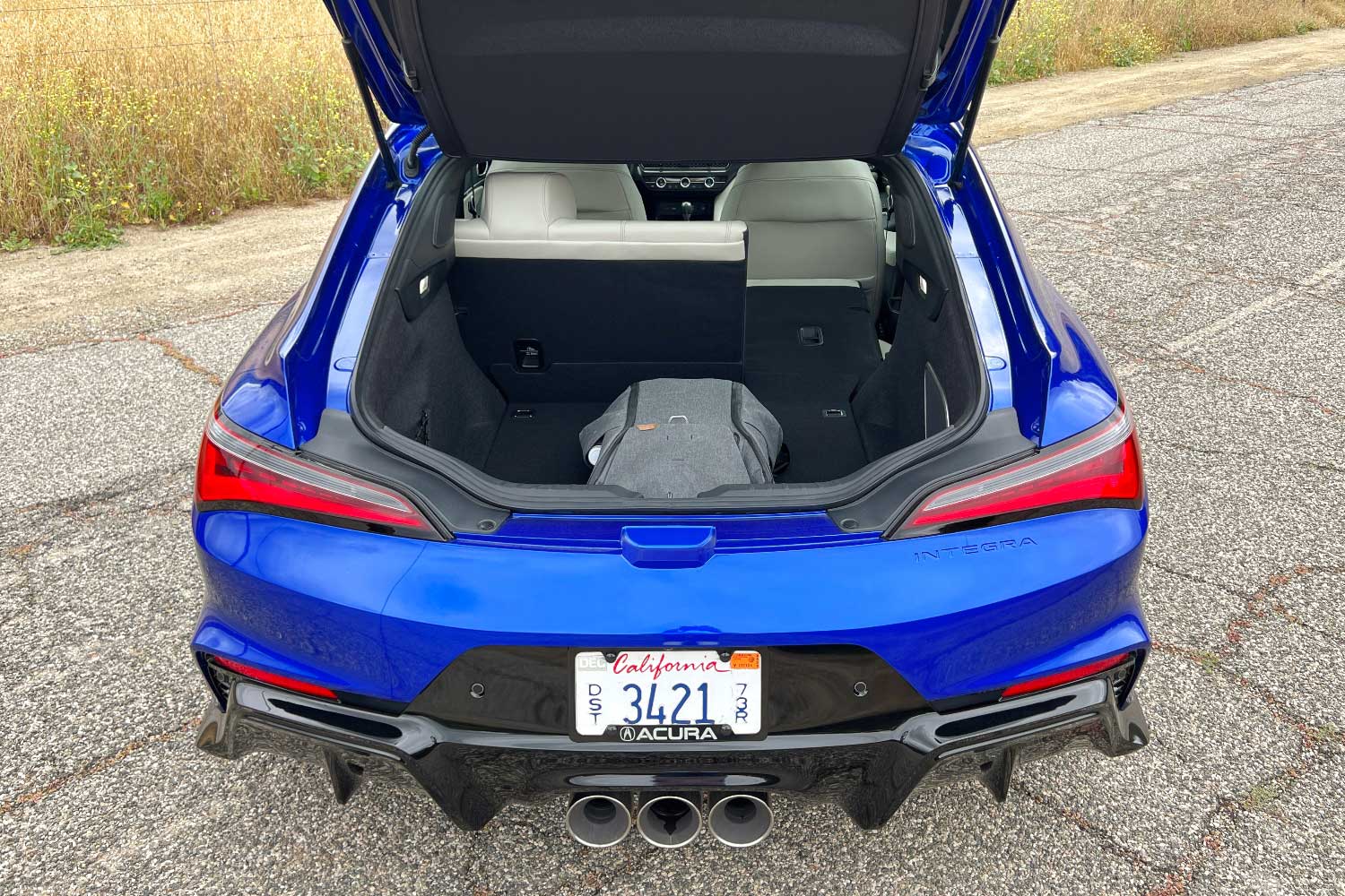 Rear cargo space of a blue 2024 Acura Integra Type S.