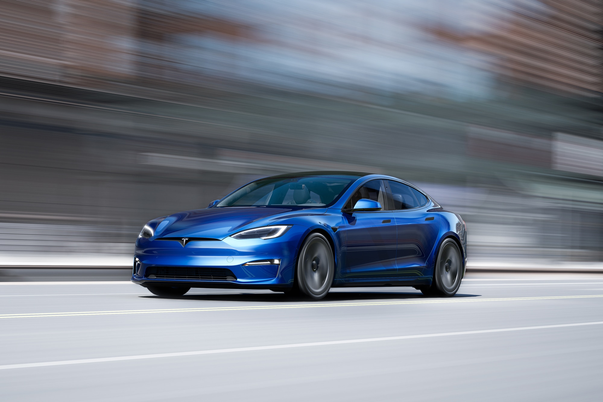 Blue 2022 Tesla Model S driving down highway