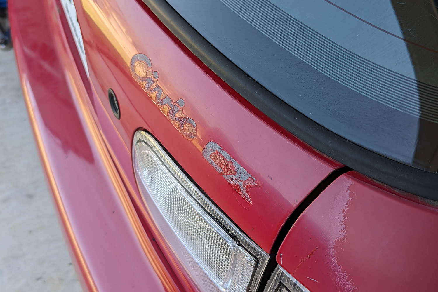 Close up of red Honda Civic with badge removed