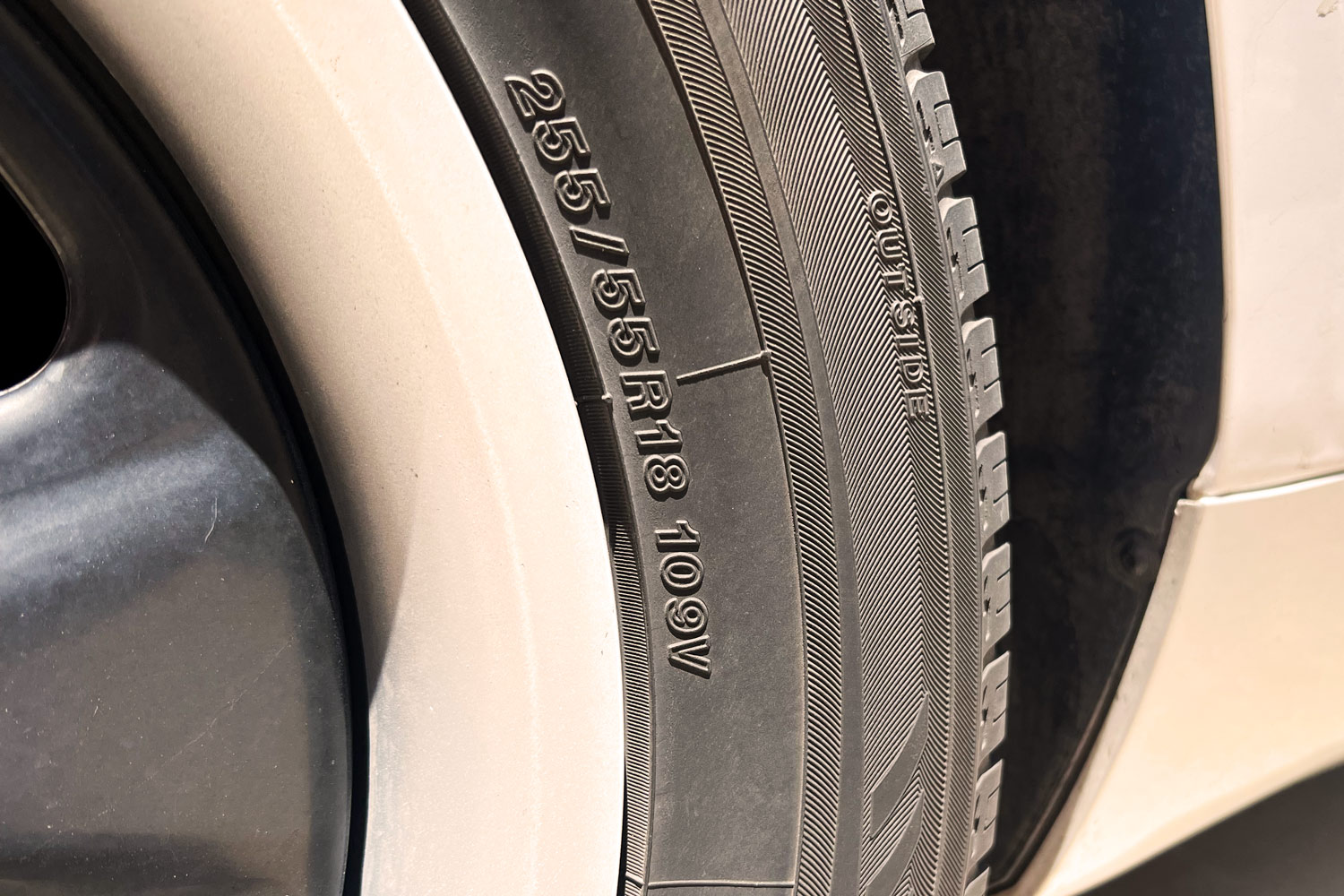 Closeup of tire showing tire size and speed rating.