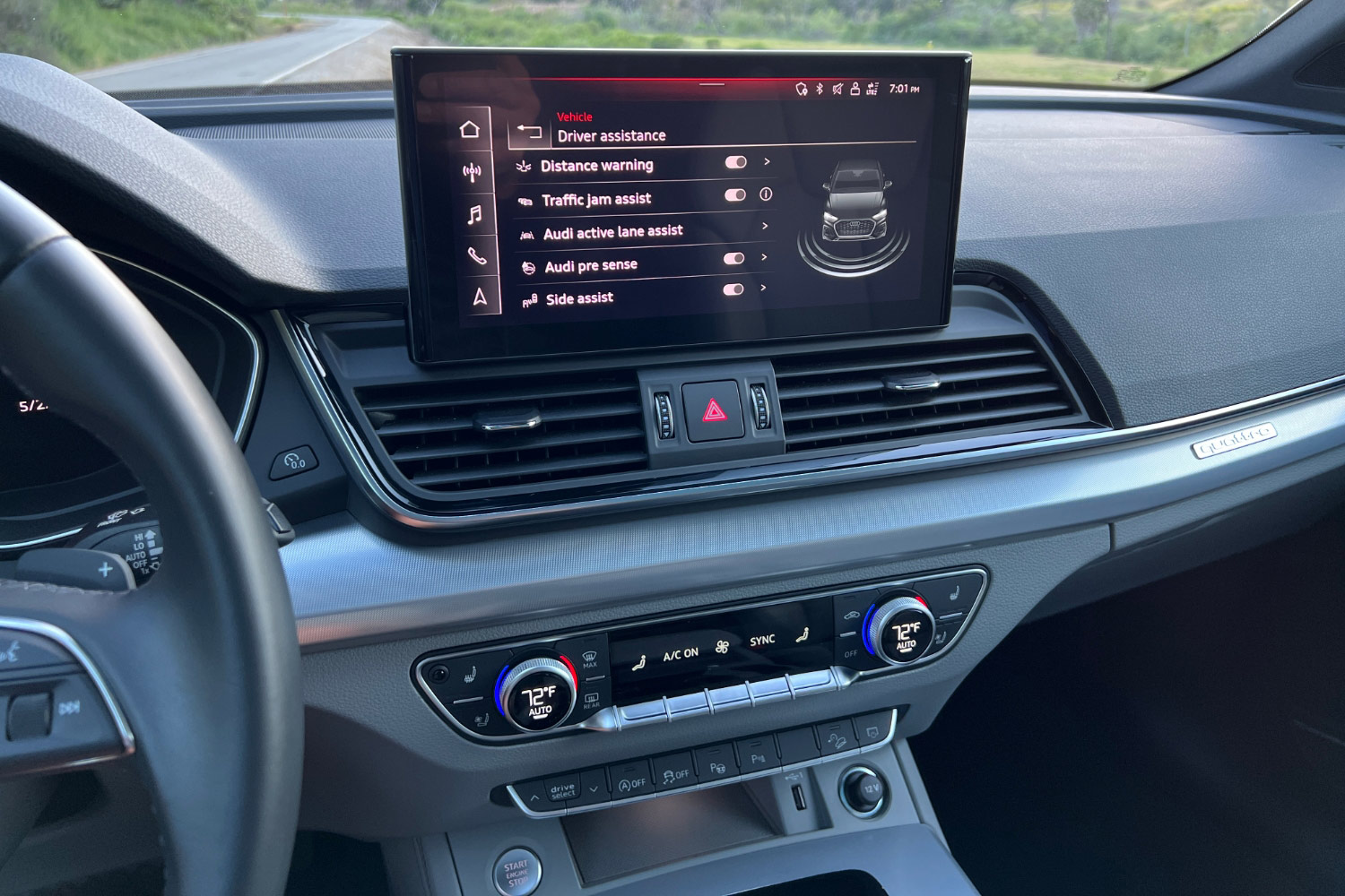 Center infotainment screen in an Audi Q5 showing list of driver assistance systems.