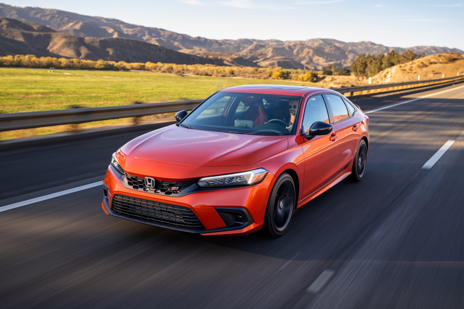 2023 Honda Civic Si driving on country road