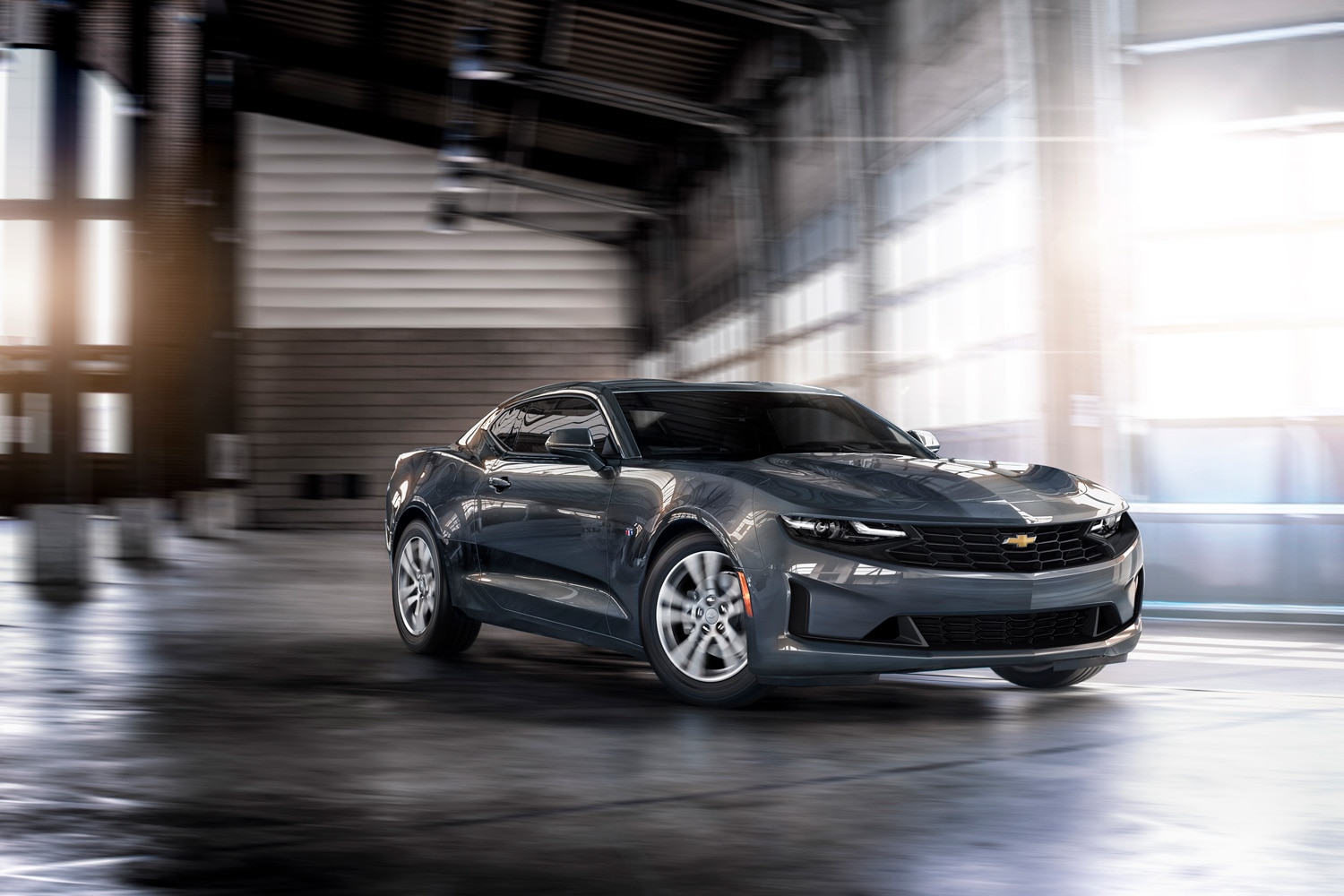 2023 Chevrolet Camaro driving inside warehouse