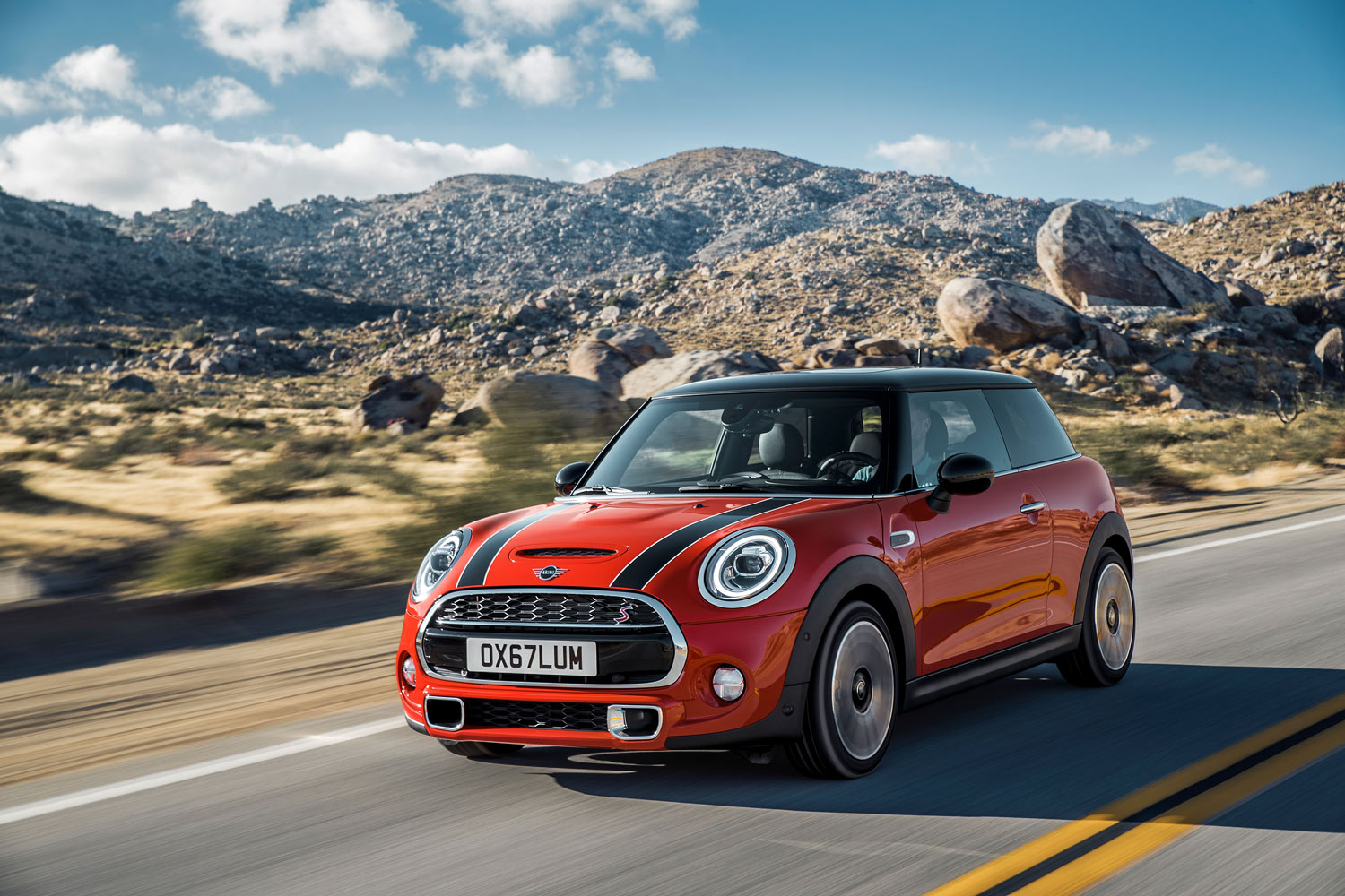 2024 Mini Cooper two door driving on road