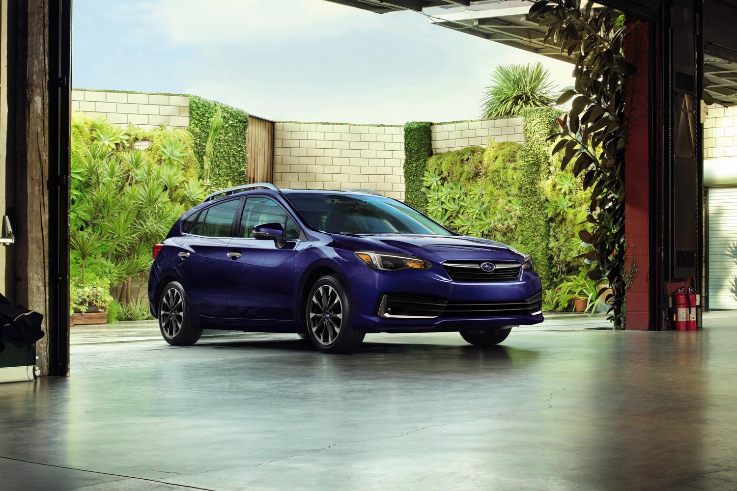 2023 Subaru Impreza hatchback parked in garage