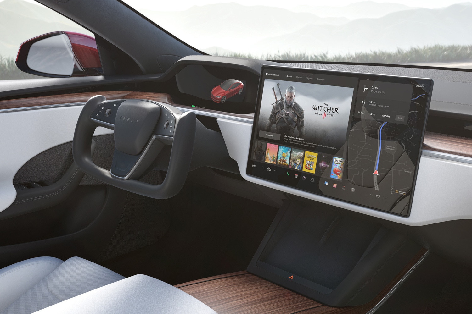 Interior of a Tesla showing a large infotainment touchscreen and steering wheel
