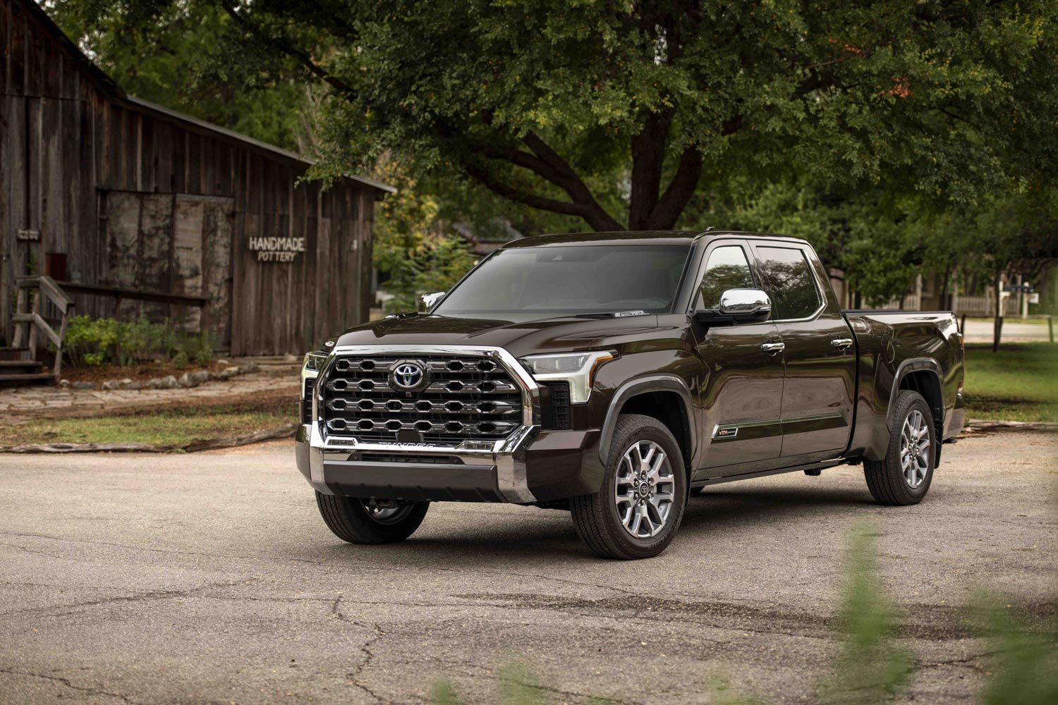 2023 Toyota Tundra parked in front of rustic barn