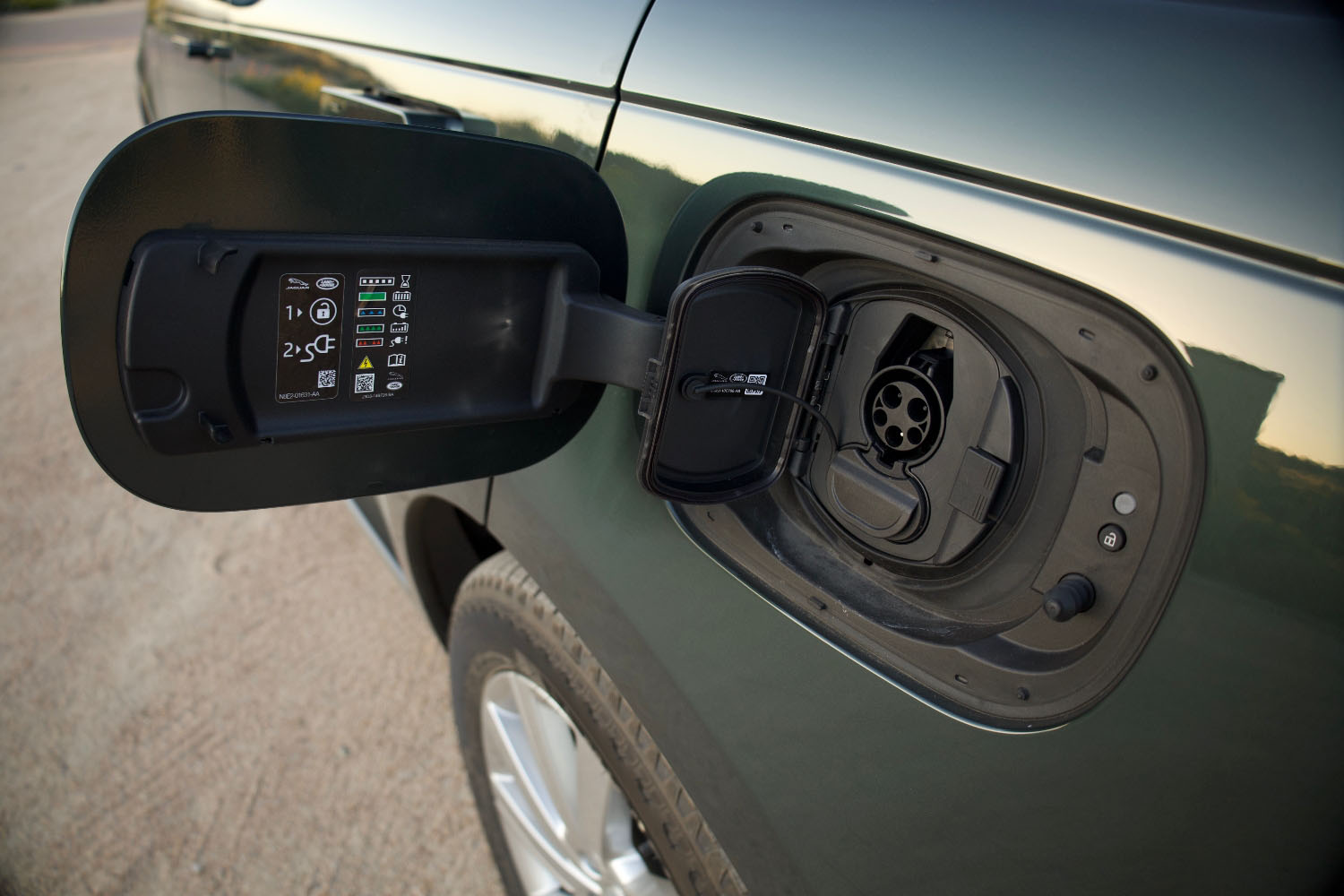 Plug-in power port of a 2023 Land Rover Range Rover hybrid in Belgravia Green