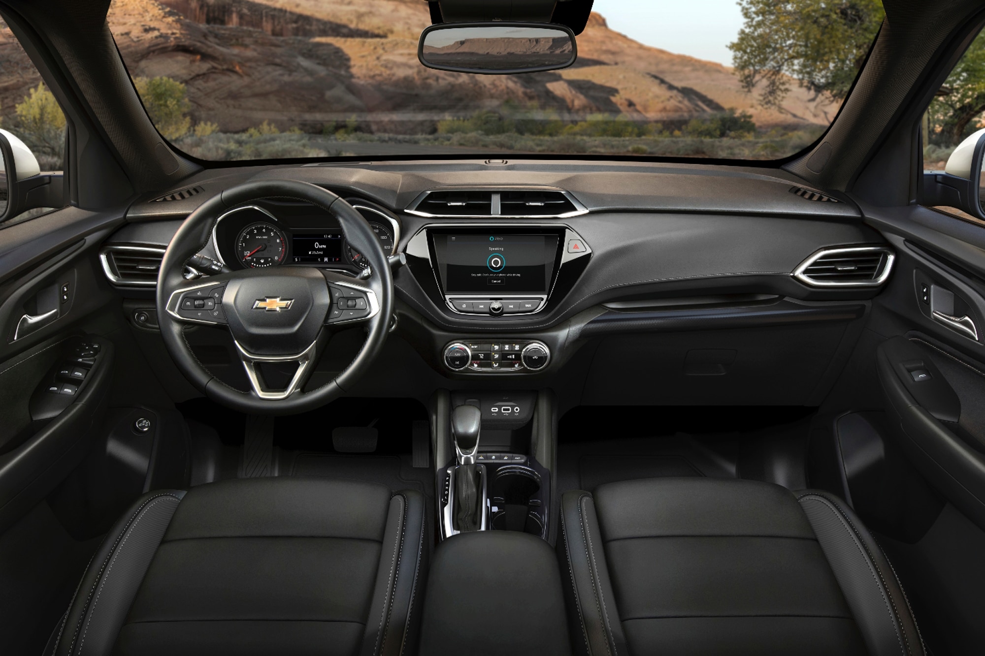 2023 Chevrolet Trailblazer interior dashboard with black leather seats and view of mountains