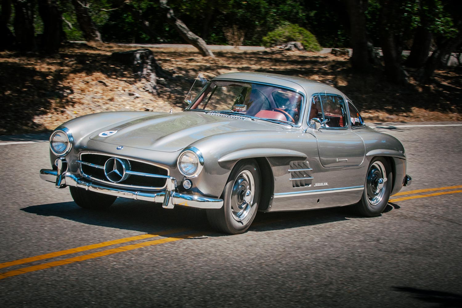 Front three-quarter view of a silver Mercedes 300 SL