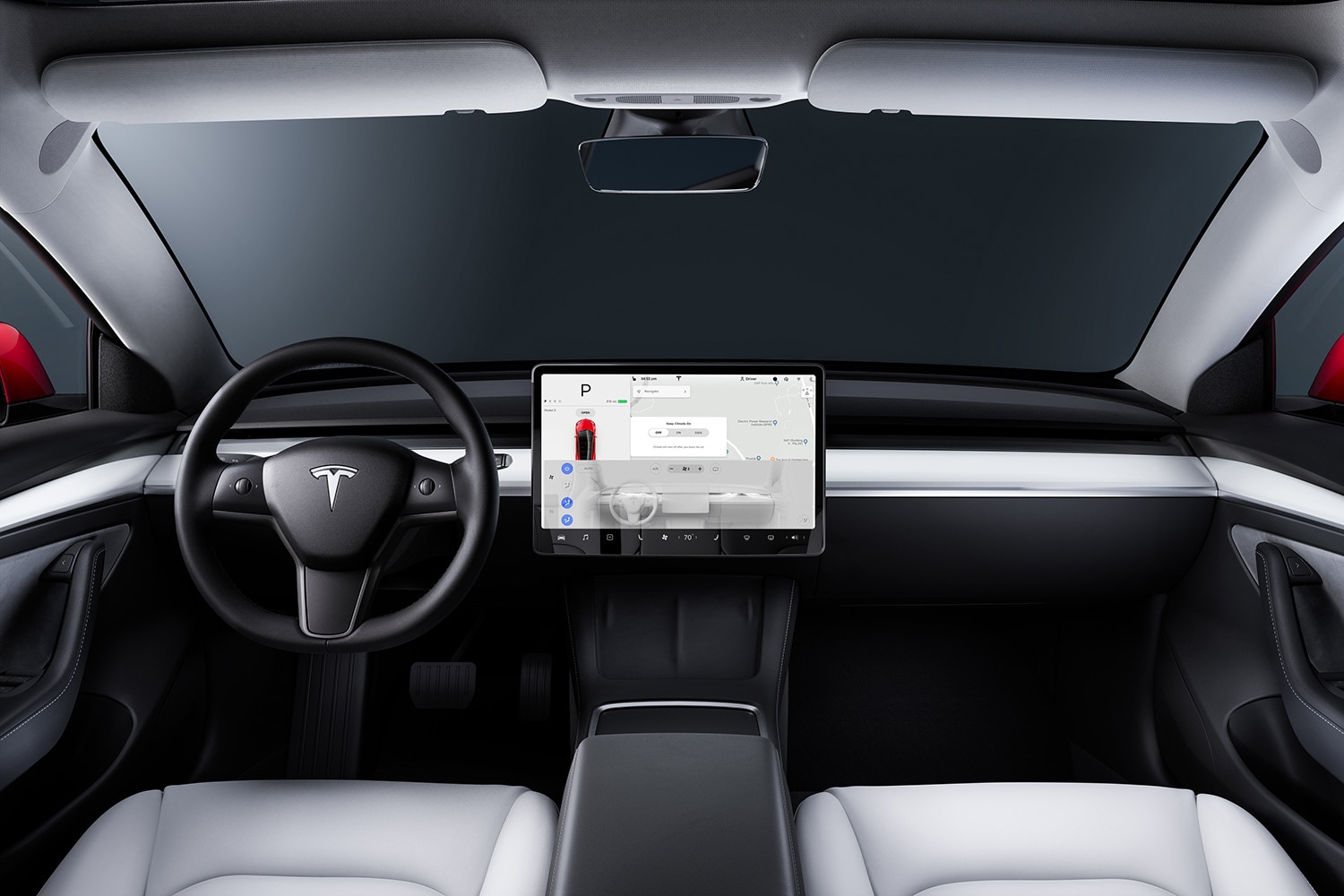 Interior front seats and infotainment system of a Tesla Model 3